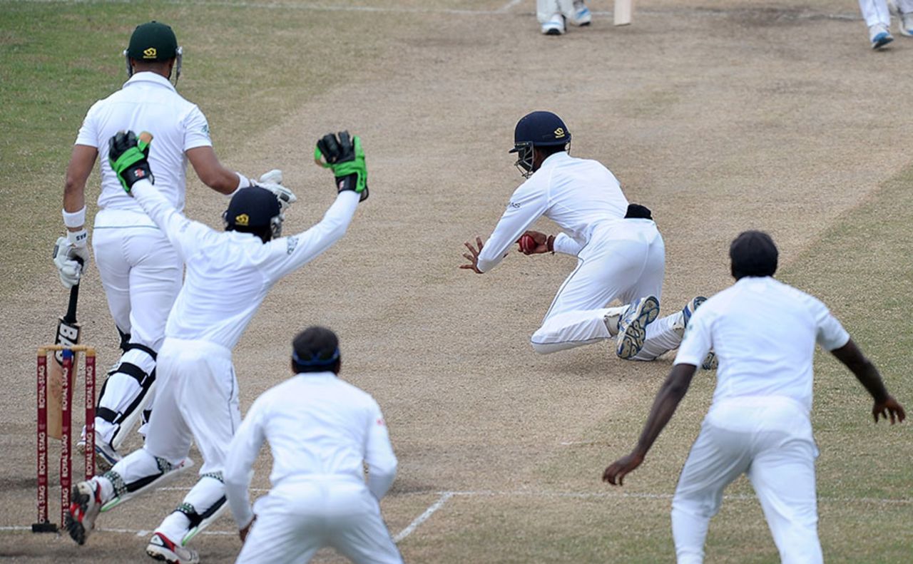 Kithuruwan Vithanage tumbles to his right to catch Alviro Petersen at silly point, Sri Lanka v South Africa, 2nd Test, Colombo, 4th day, July 27, 2014