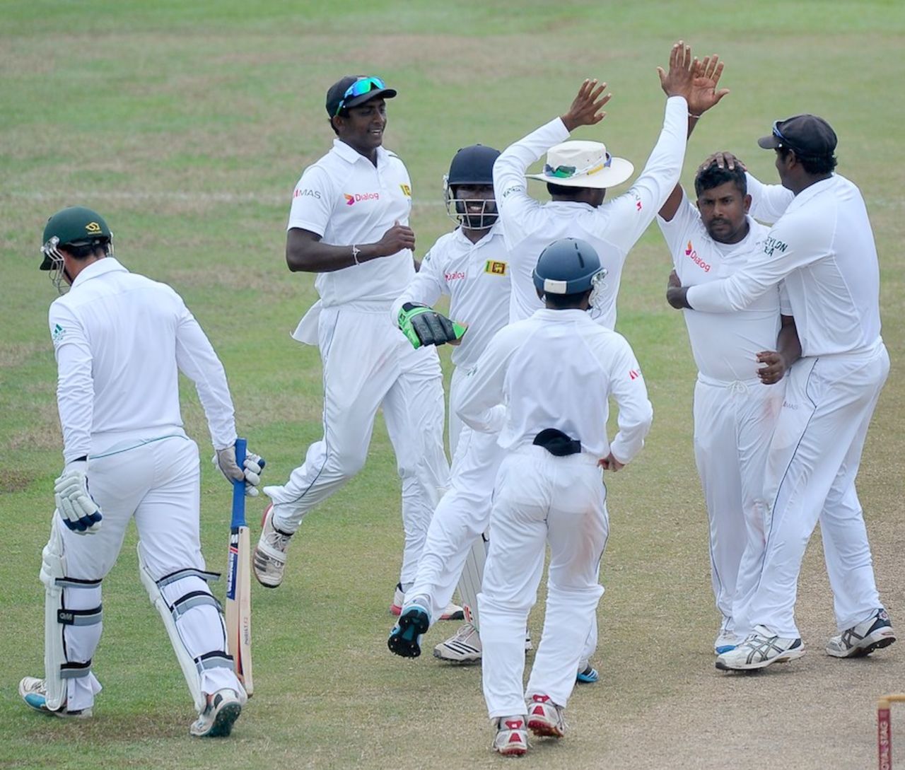 Rangana Herath is mobbed by team-mates for dismissing Quinton de Kock, Sri Lanka v South Africa, 2nd Test, Colombo, 5th day, July 28, 2014