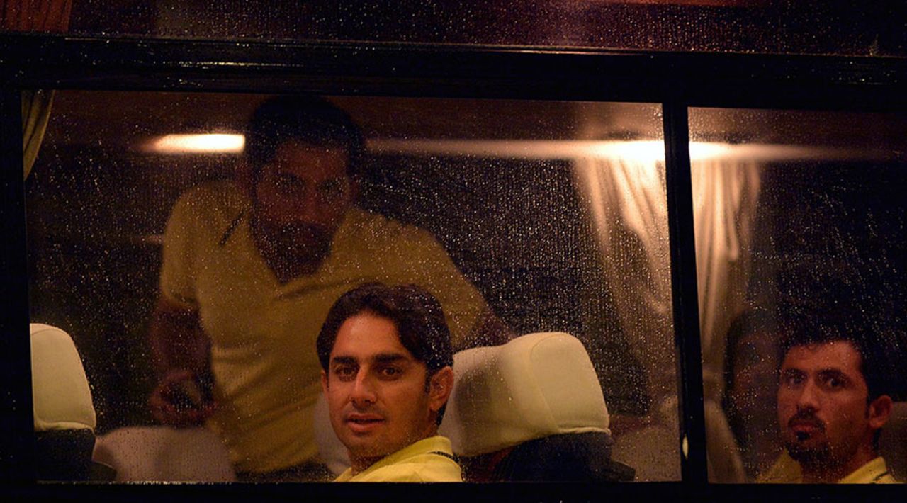 Saeed Ajmal and Junaid Khan look out of Pakistan's team bus after the team's arrival in Galle, Galle, August 3, 2014
