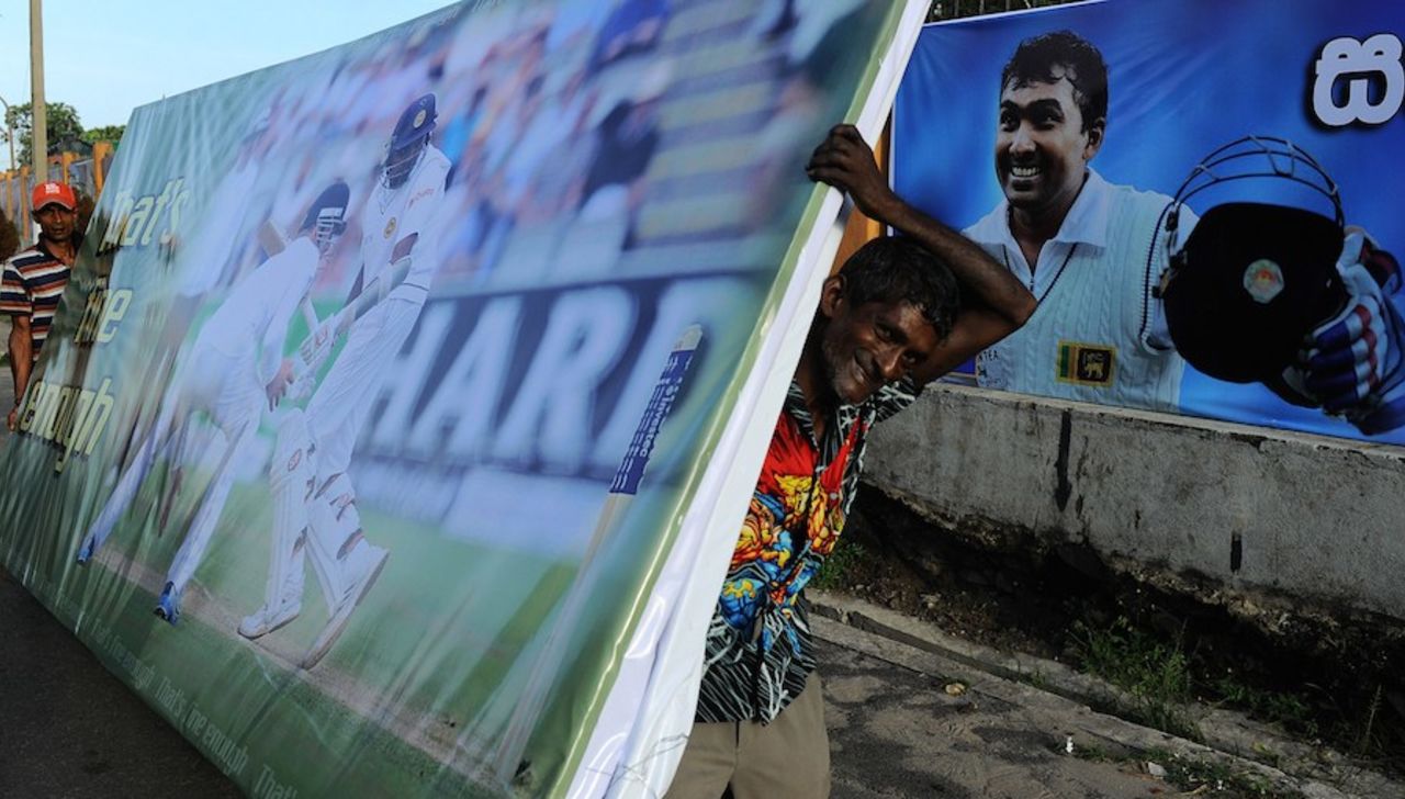 Workers carry a billboard of Mahela Jayawardene ahead of his last Test series, Galle, August 3, 2014