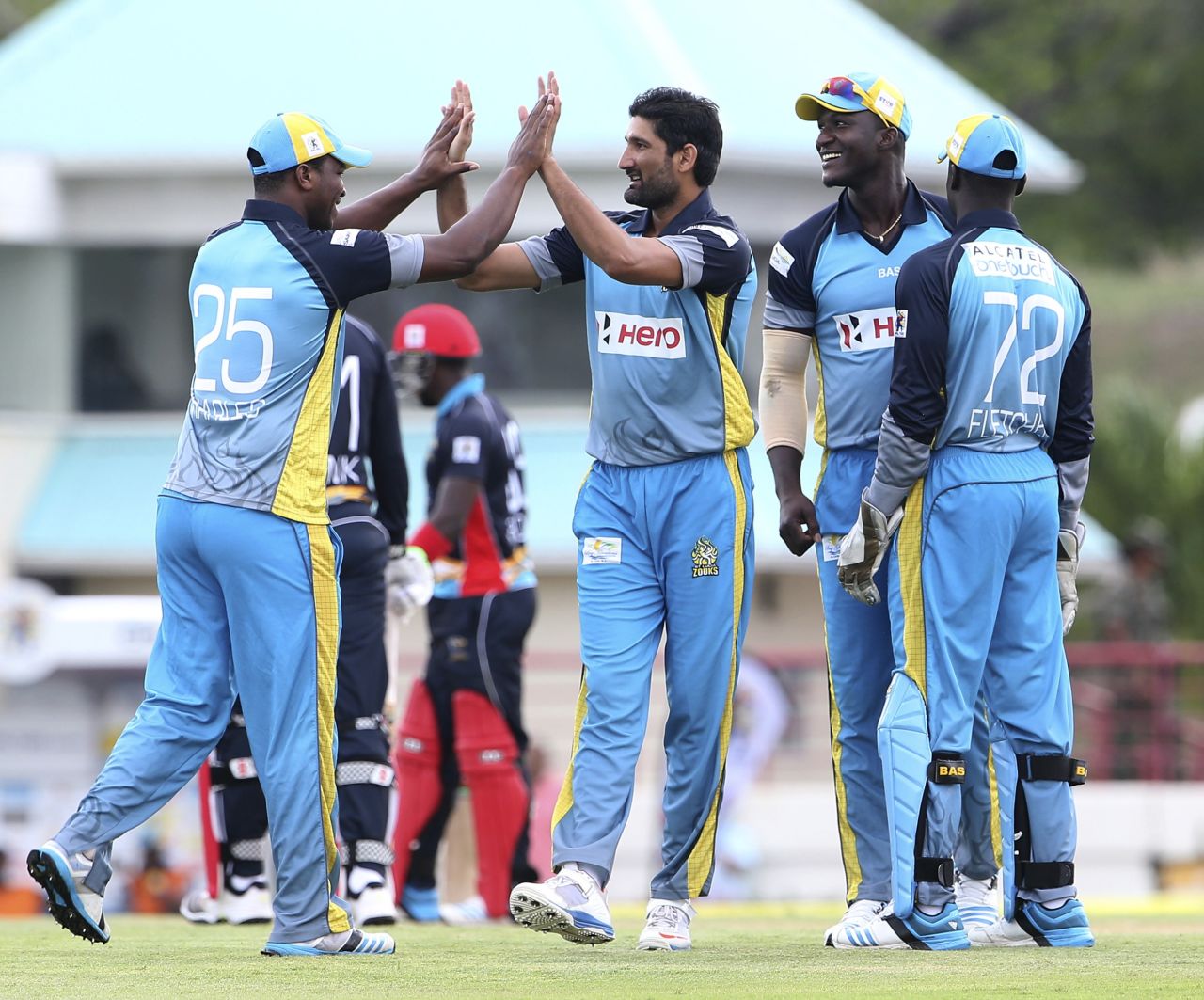 Sohail Tanvir gets congratulated after one of his three wickets, St Lucia Zouks v Antigua Hawksbills, CPL 2014, Gros Islet, August 3, 2014
