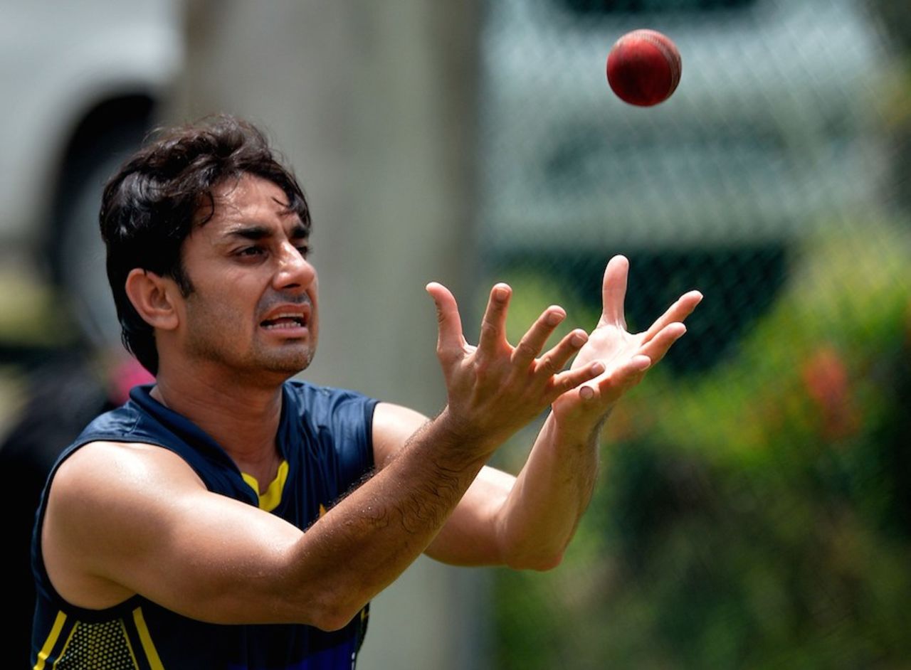 Grab the opportunity: Saeed Ajmal prepares to put his hands under the ball, Galle, August 4, 2014