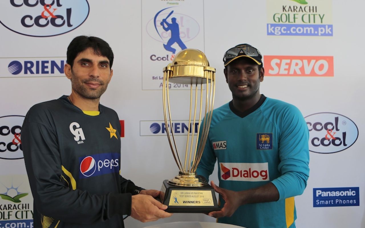 Misbah-ul-Haq and Angelo Mathews pose with the trophy, Galle, August 5, 2014