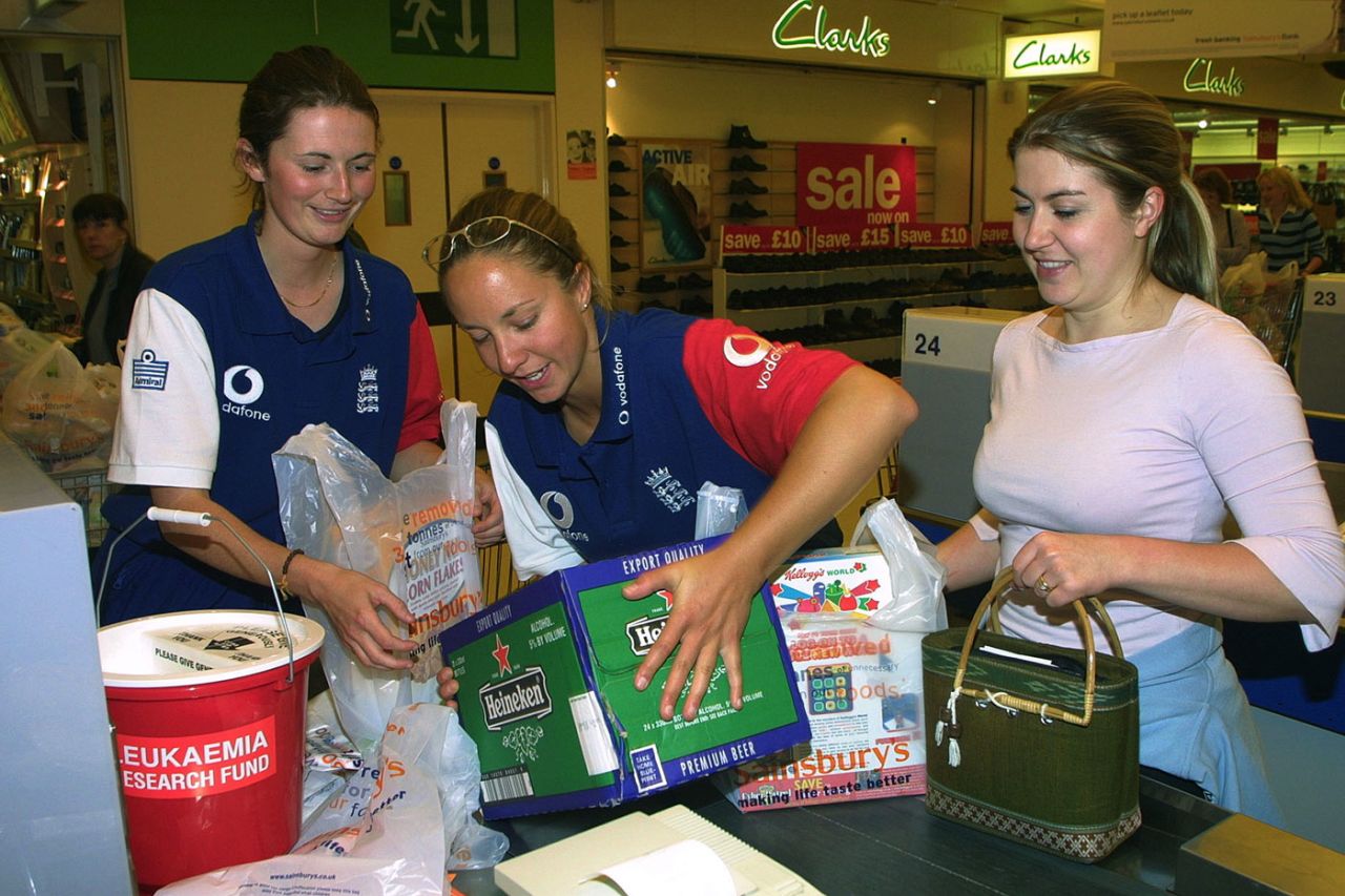 Charlotte Edwards and Clare Connor get the beers in, in aid of Leukaemia Research at the Sainsbury's Savacentre in Reading, July 5, 2002