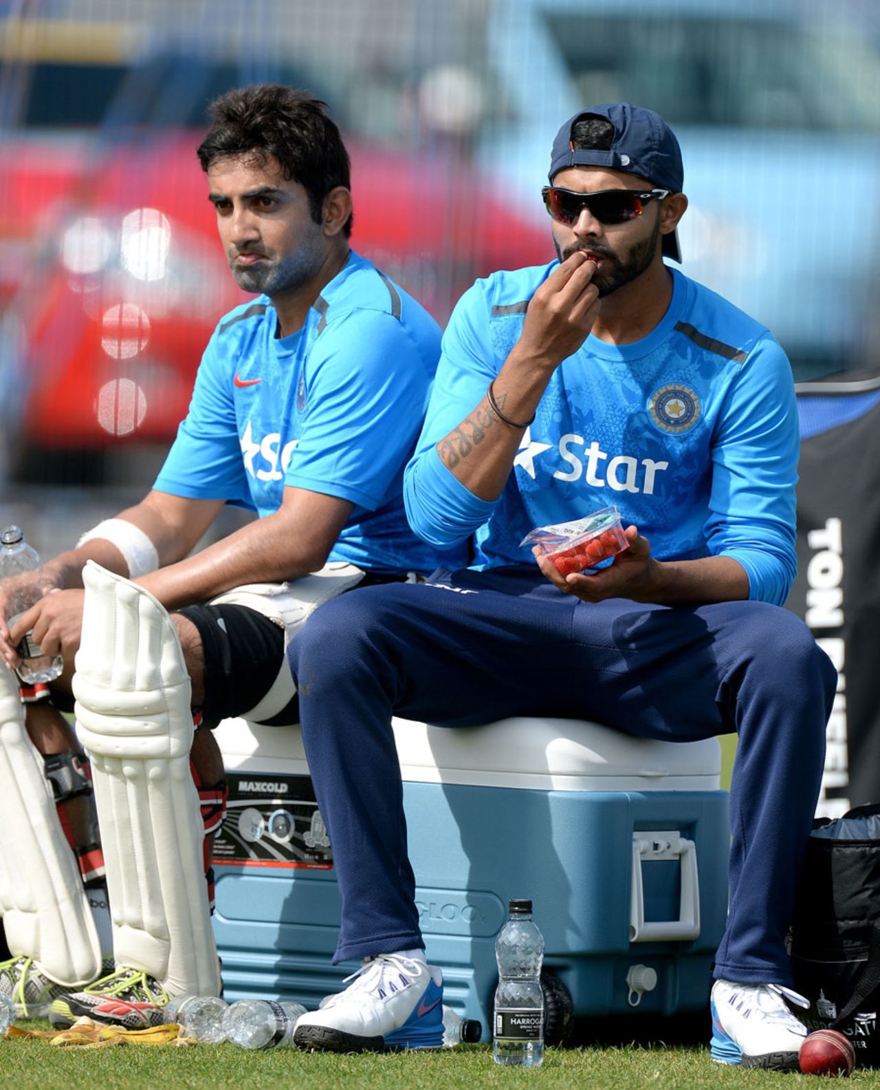 Gautam Gambhir and Ravindra Jadeja have a rest during India practice, Old Trafford, August 5, 2014