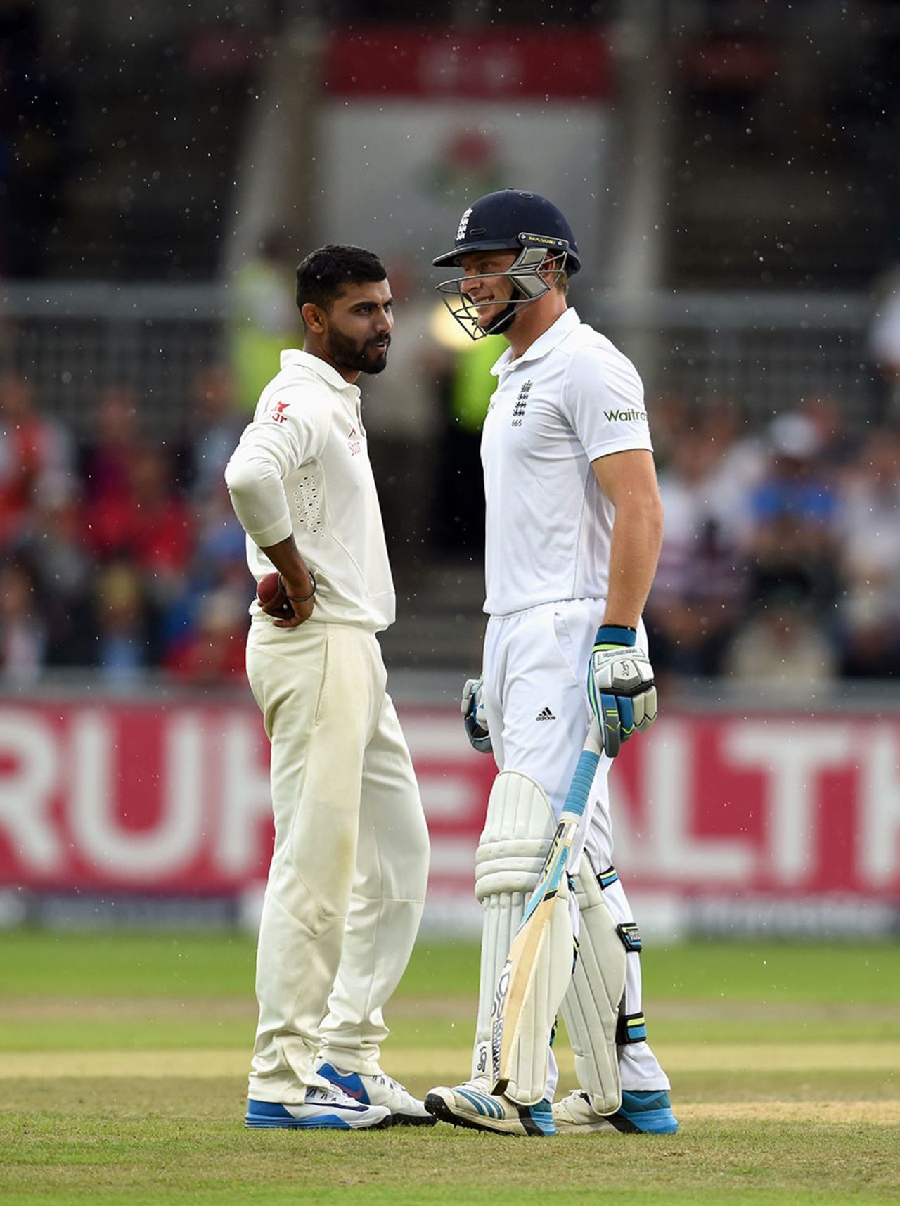 Ravindra Jadeja has a word with Jos Buttler as the players leave the field for rain, England v India, 4th Test, Old Trafford, 2nd day, August 8, 2014