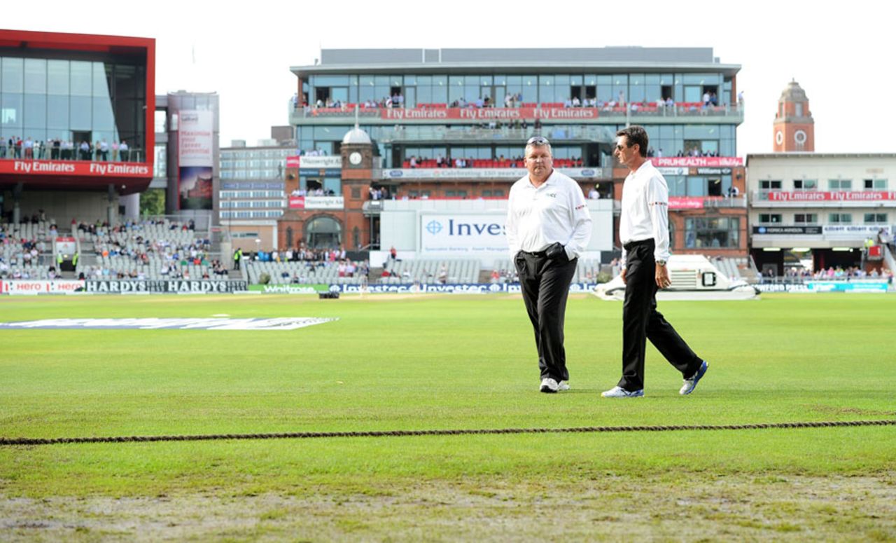 A wet outfield was the problem for umpires Marais Erasmus and Rod Tucker, England v India, 4th Test, Old Trafford, 2nd day, August 8, 2014