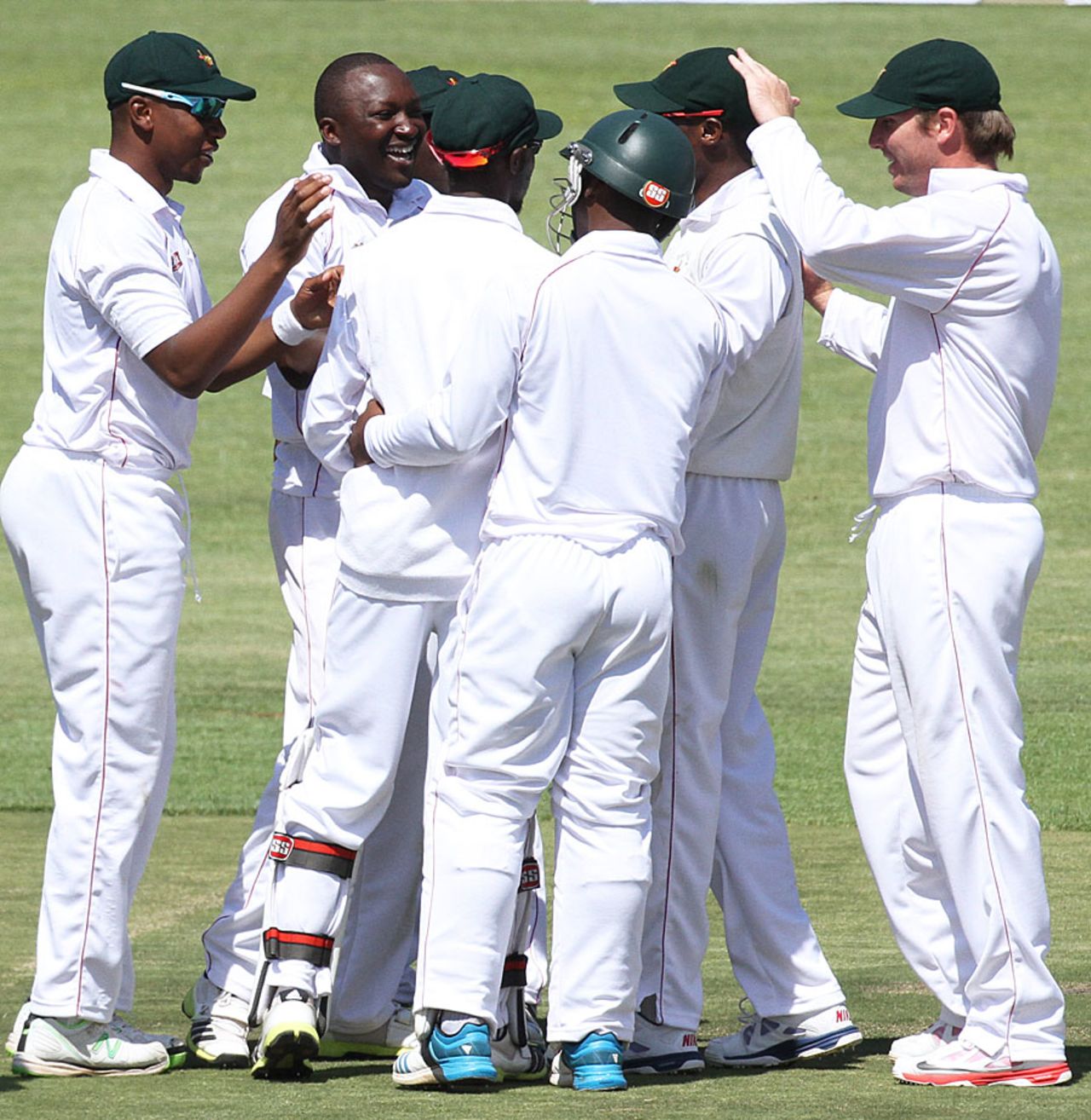 John Nyumbu celebrates his first Test wicket with his team-mates, Zimbabwe v South Africa, only Test, Harare, 2nd day, August 10, 2014