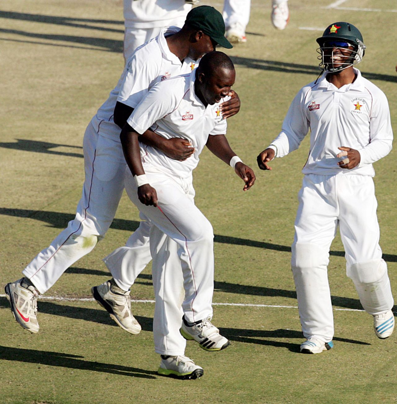 John Nyumbu and his team-mates celebrate the fall of AB de Villiers, Zimbabwe v South Africa, only Test, Harare, 2nd day, August 10, 2014