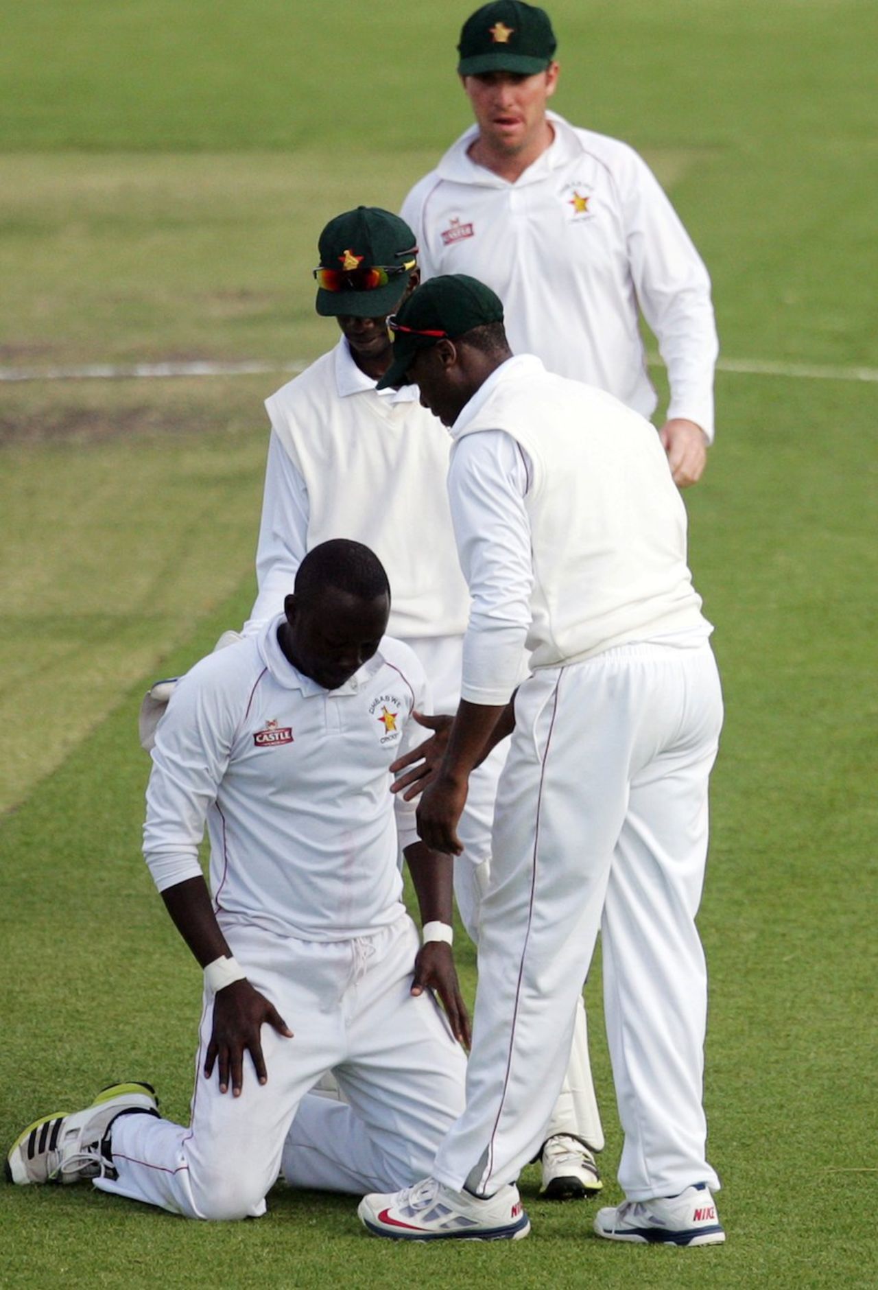 John Nyumbu sinks to his knees after claiming a five-for on debut, Zimbabwe v South Africa, only Test, Harare, 3rd day, August 11, 2014
