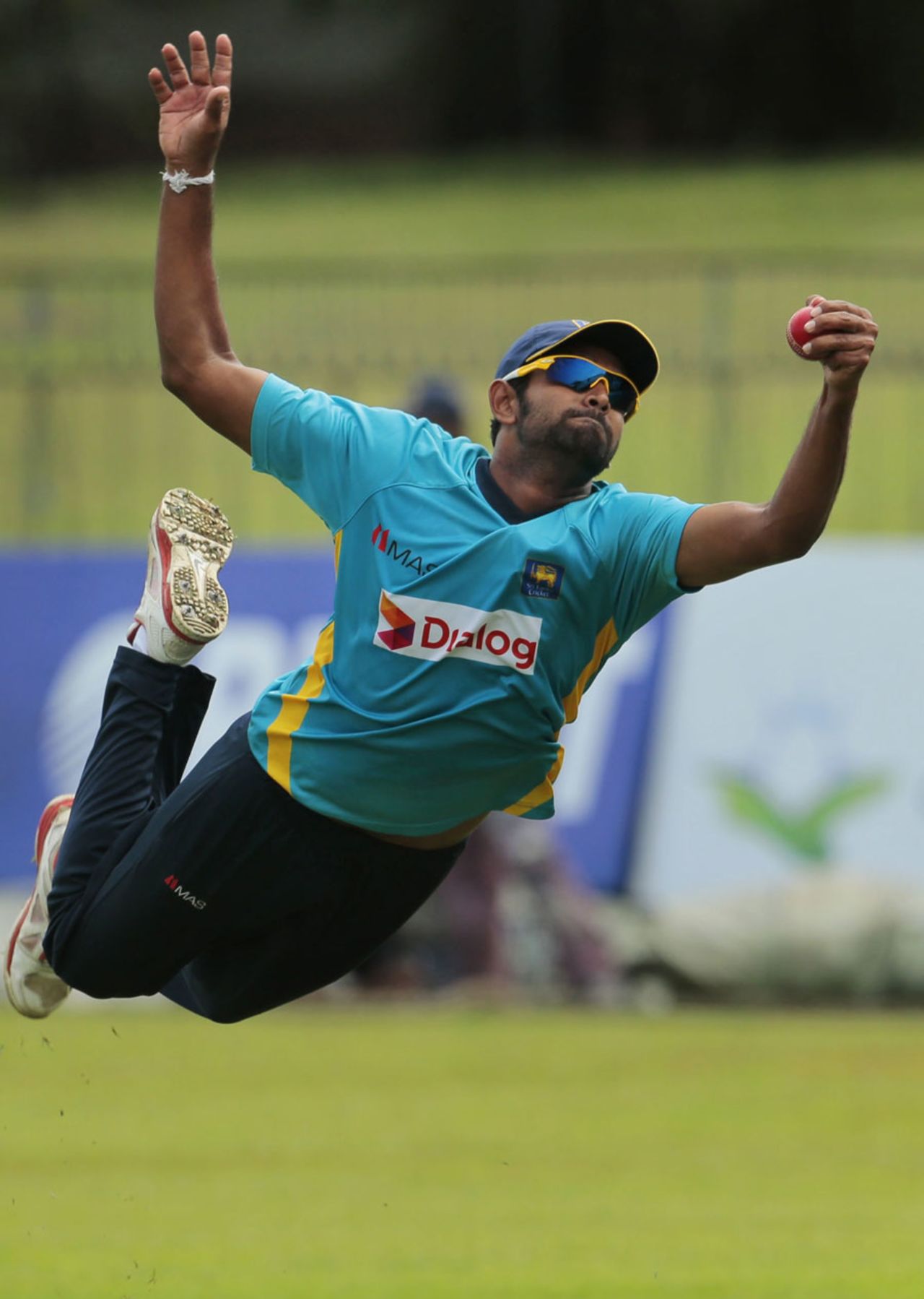 Lahiru Thirimanne goes airborne to take a catch, Colombo, August 13, 2014