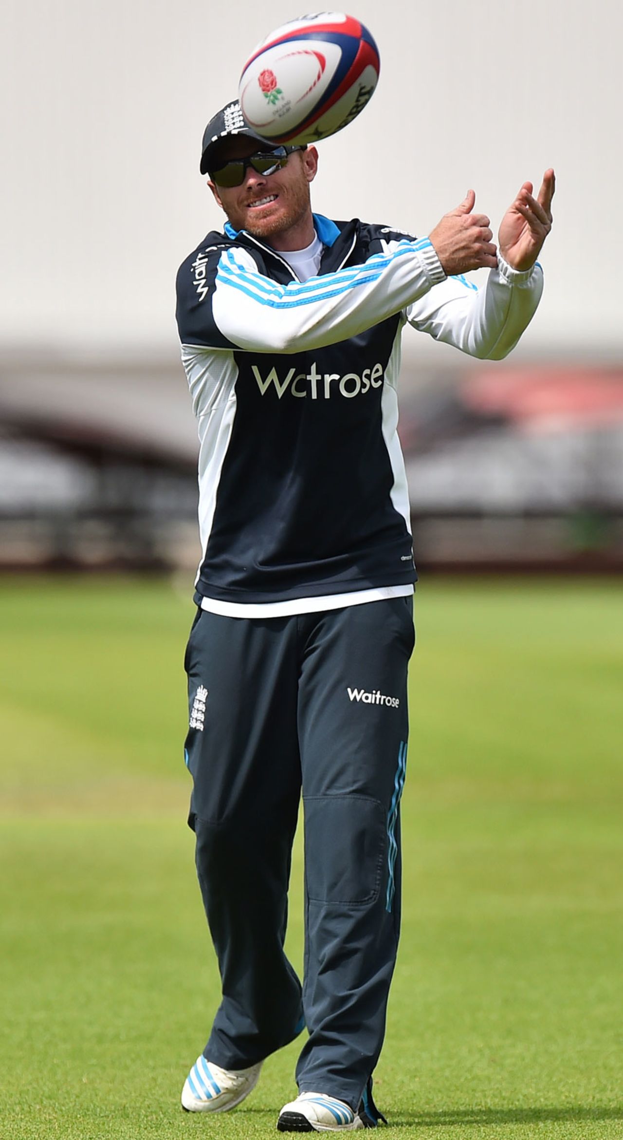 Ian Bell passes a rugby ball during an England warm-up, The Oval, August 13, 2014