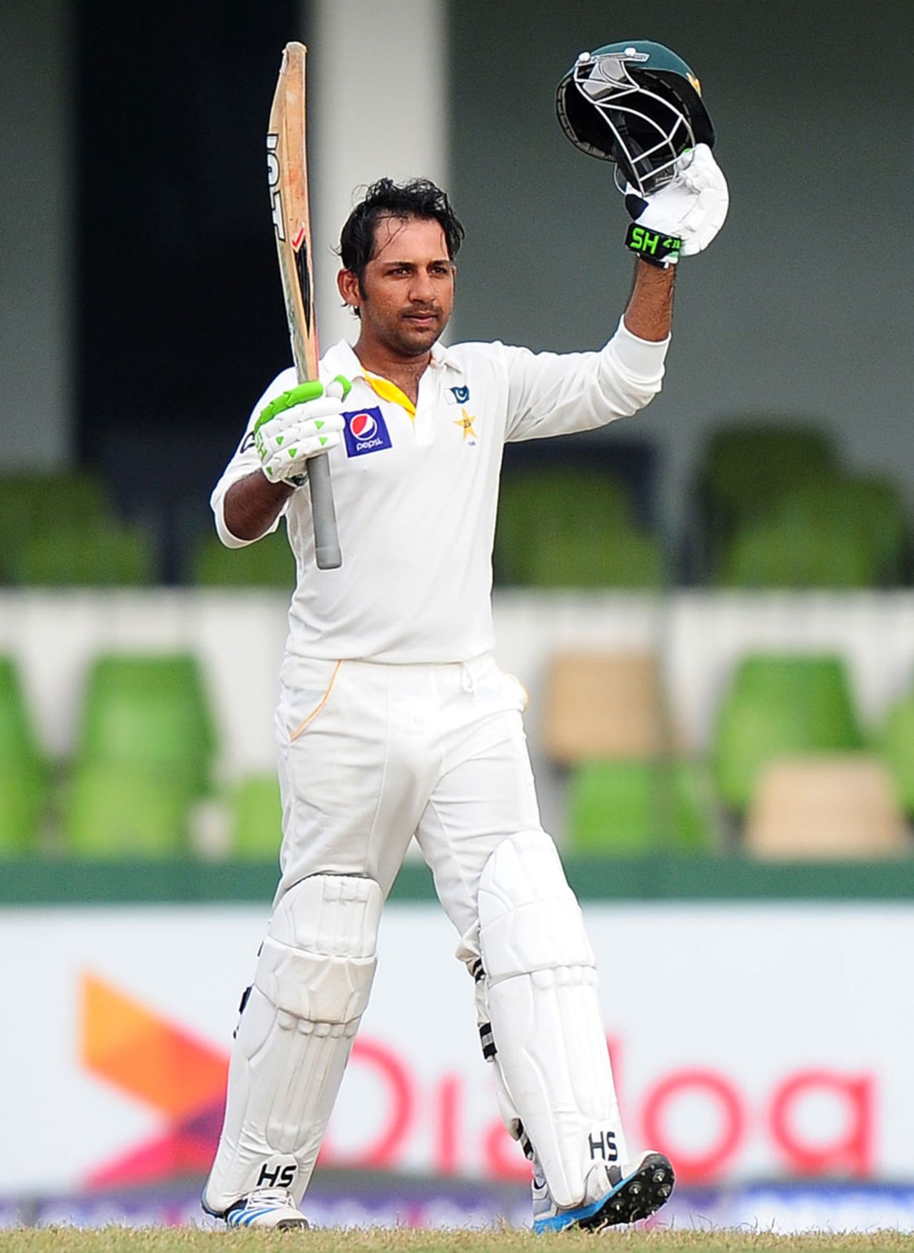 Sarfraz Ahmed raises his bat after reaching a half-century, Sri Lanka v Pakistan, 2nd Test, Colombo, 2nd day, August 15, 2014