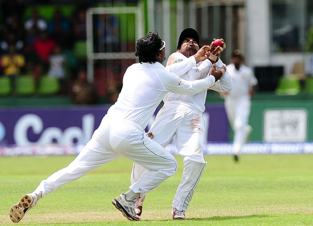 Kumar Sangakkara nearly collides with Kaushal Silva as he takes the catch that ends the Test match, Sri Lanka v Pakistan, 2nd Test, SSC, 5th day, August 18, 2014