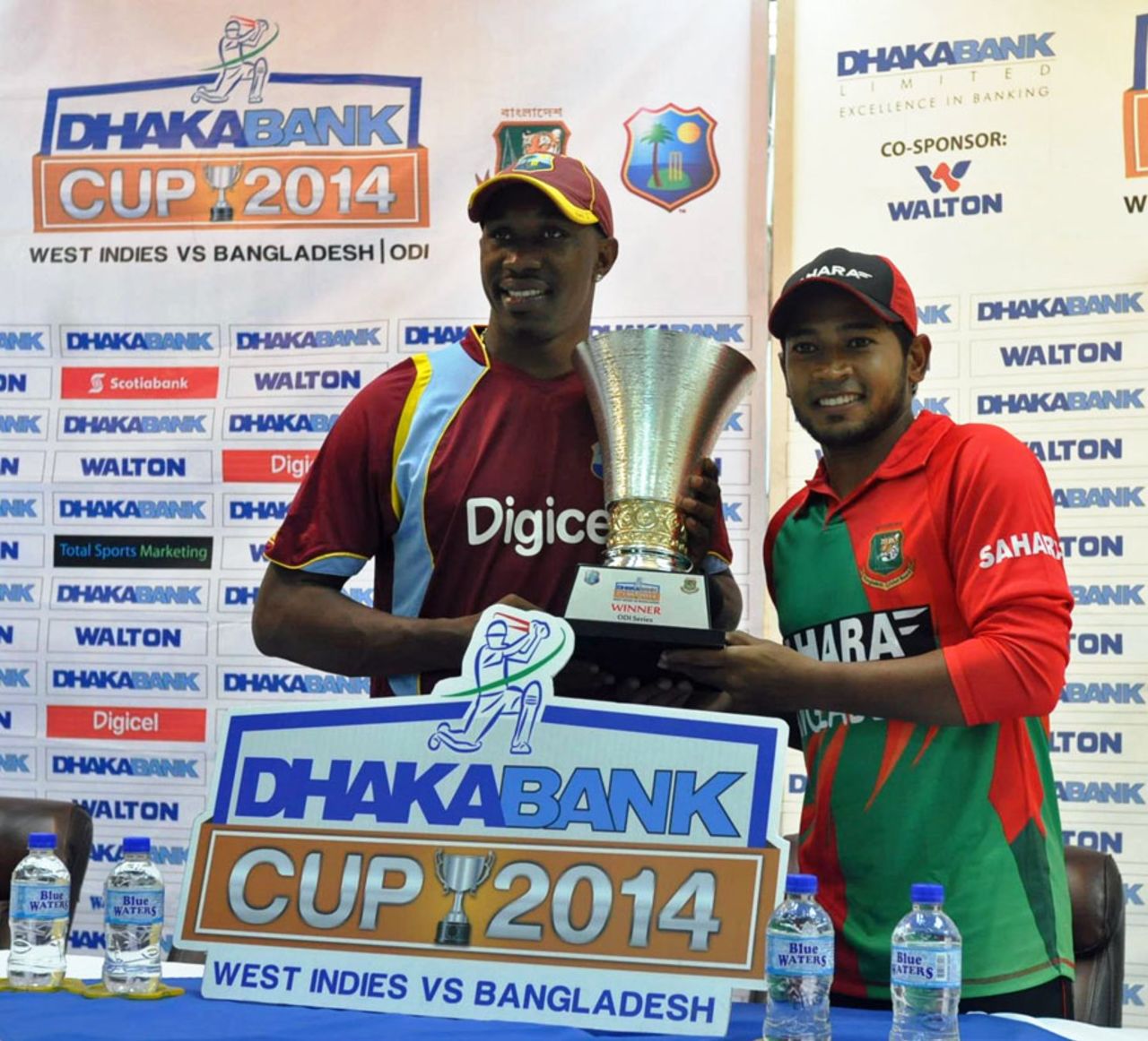 Dwayne Bravo and Mushfiqur Rahim pose with the ODI series trophy, Grenada, August 19, 2014