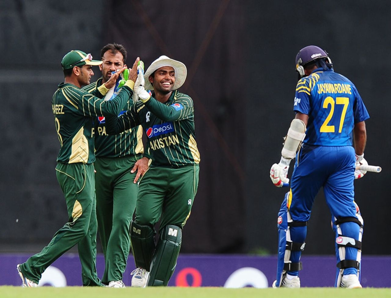 The Pakistan players celebrate the run-out of Mahela Jayawardene, Sri Lanka v Pakistan, 1st ODI, Hambantota, August 23, 2014