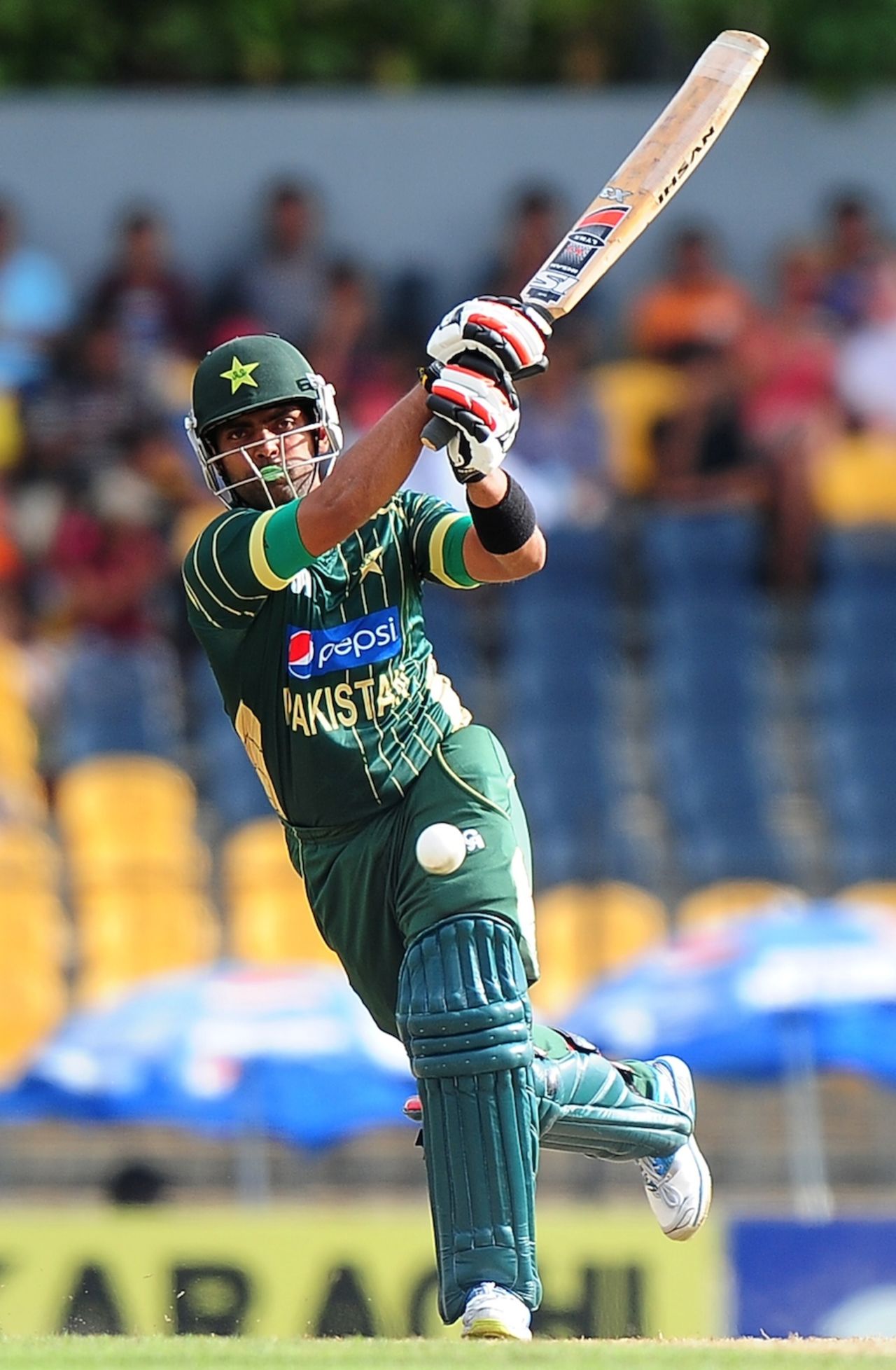 Umar Akmal smashes one down the ground, Sri Lanka v Pakistan, 1st ODI, Hambantota, August 23, 2014