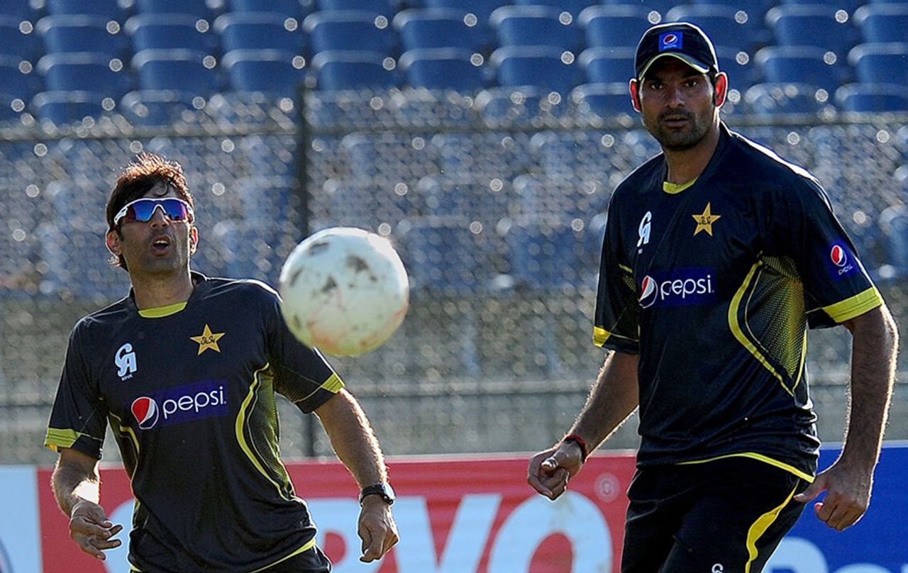 Misbah-ul-Haq and Mohammad Irfan warm up with a game of football, Hambantota, August 25, 2014