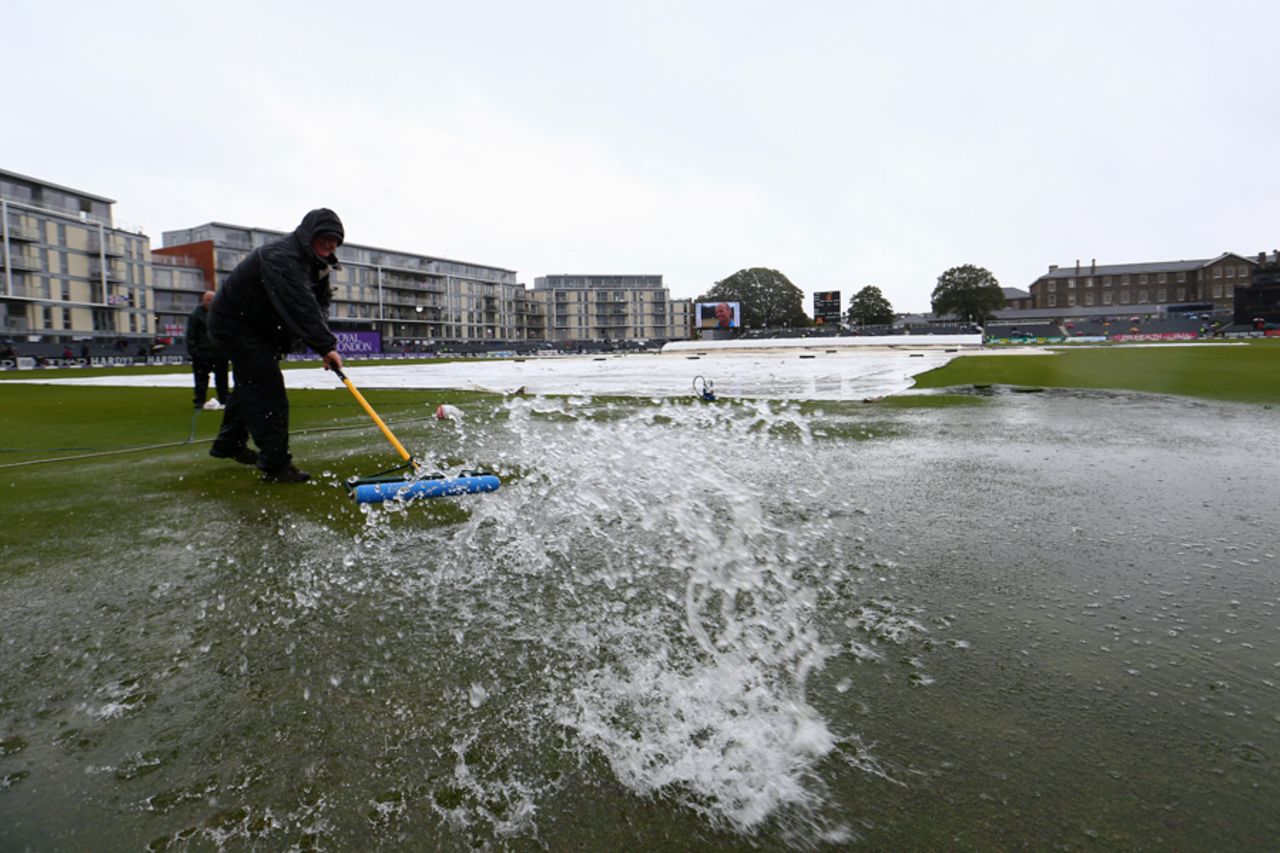Water is swept off the outfield at Bristol County Ground, England v India, 1st ODI, Bristol, August 25, 2014