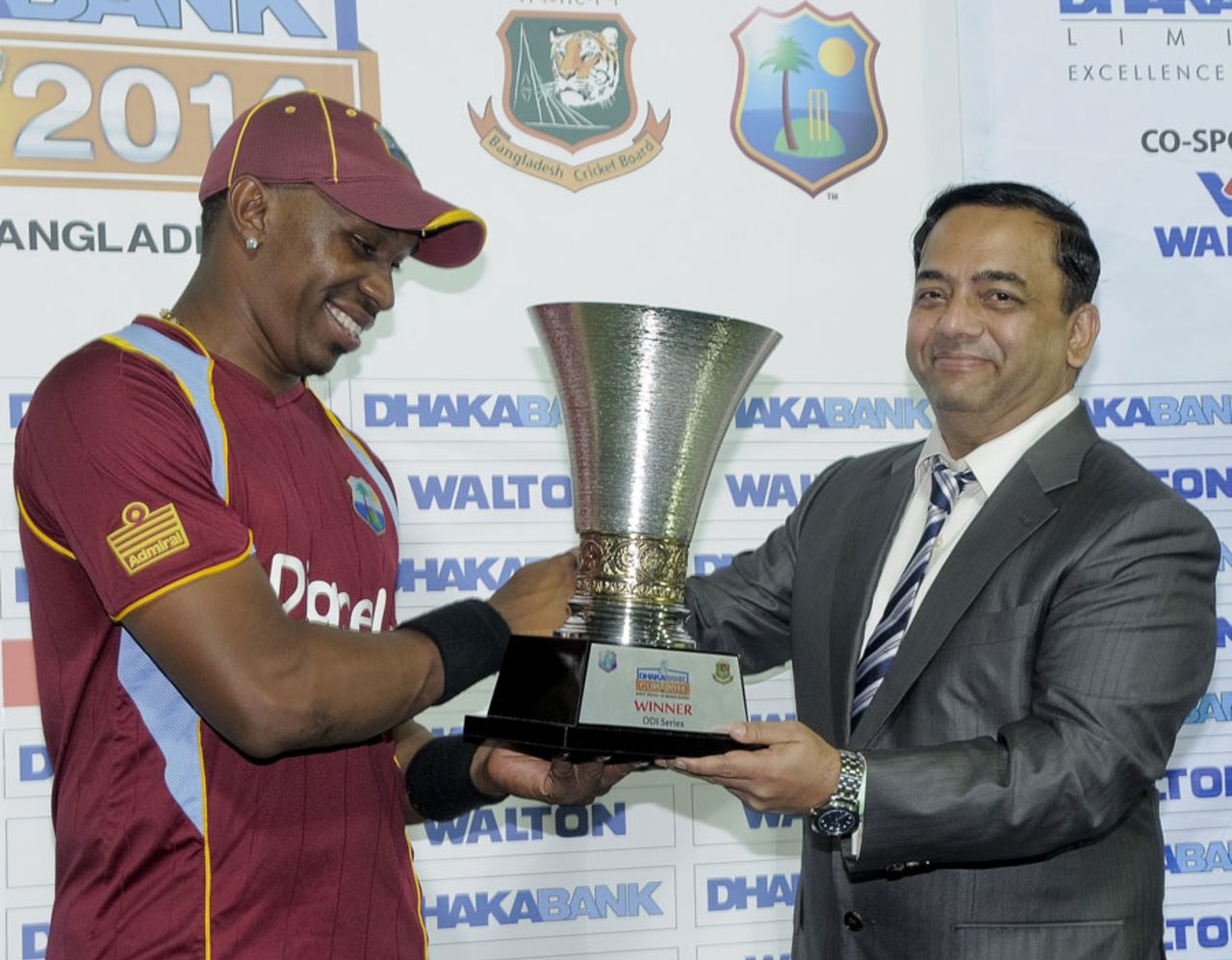 A beaming Dwayne Bravo accepts the series trophy, West Indies v Bangladesh, 3rd ODI, Basseterre, St Kitts, August 25, 2014
