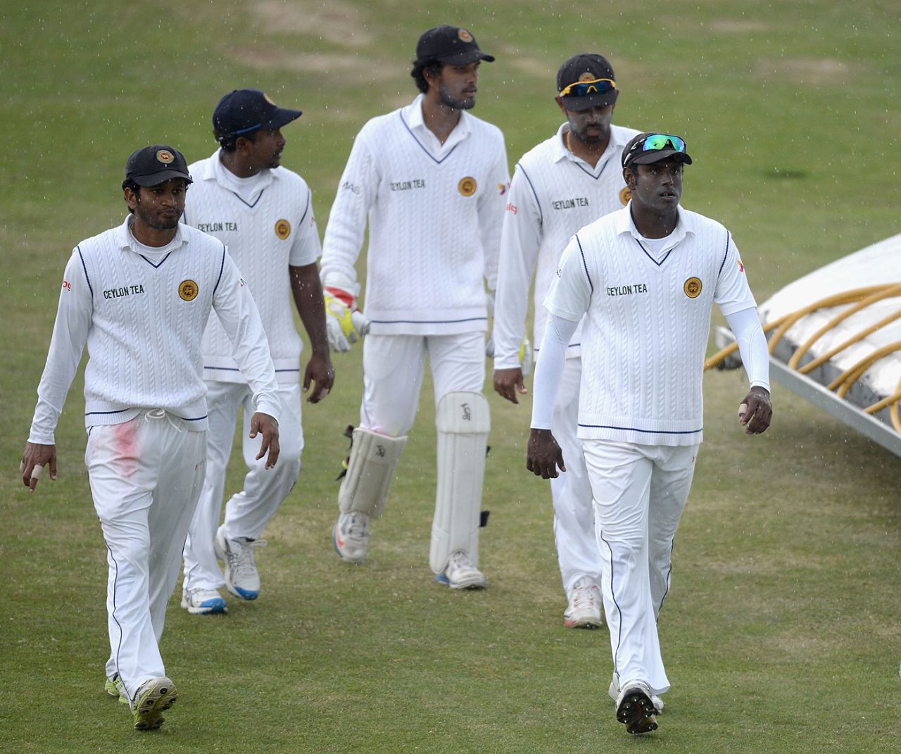 The Sri Lankan players leave the field after rain intervenes, England v Sri Lanka, 2nd Test, Headingley, June 24, 2014