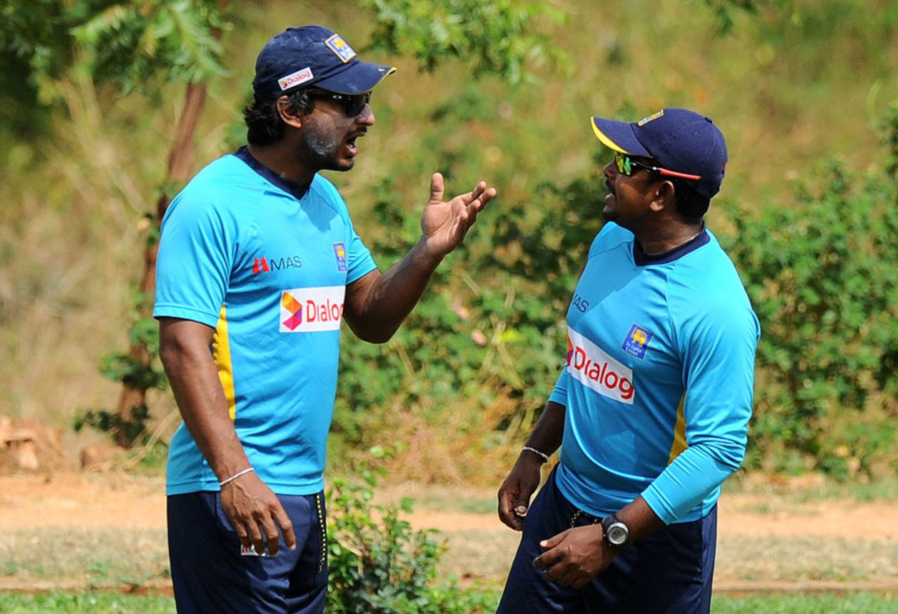 Kumar Sangakkara has a word with Rangana Herath during a practice session, Dambulla, August 29, 2014