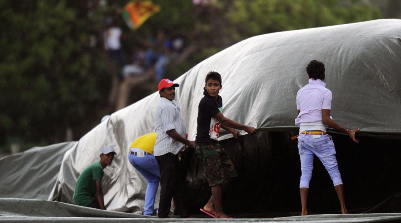 The Sri Lanka ground staff break out a tarpaulin, Sri Lanka v Pakistan, 3rd ODI, Dambulla, August 30, 2014