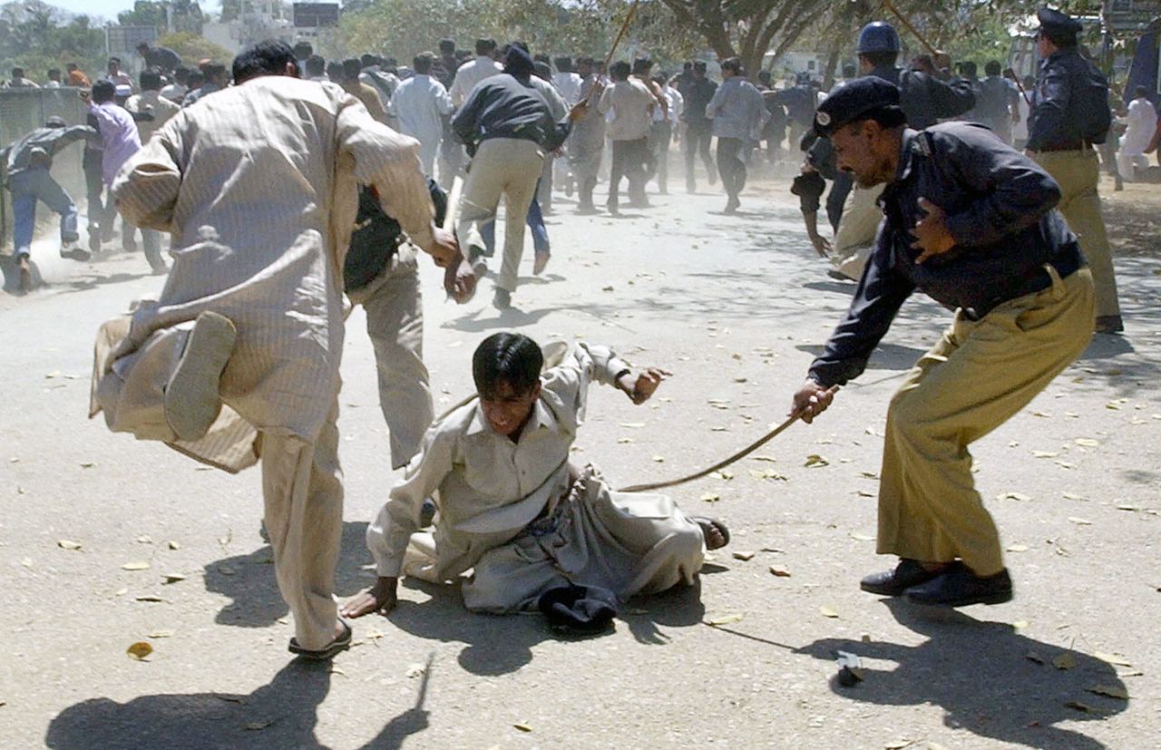 Police lath-charge fans protesting the lack of tickets in Karachi, March 7, 2004