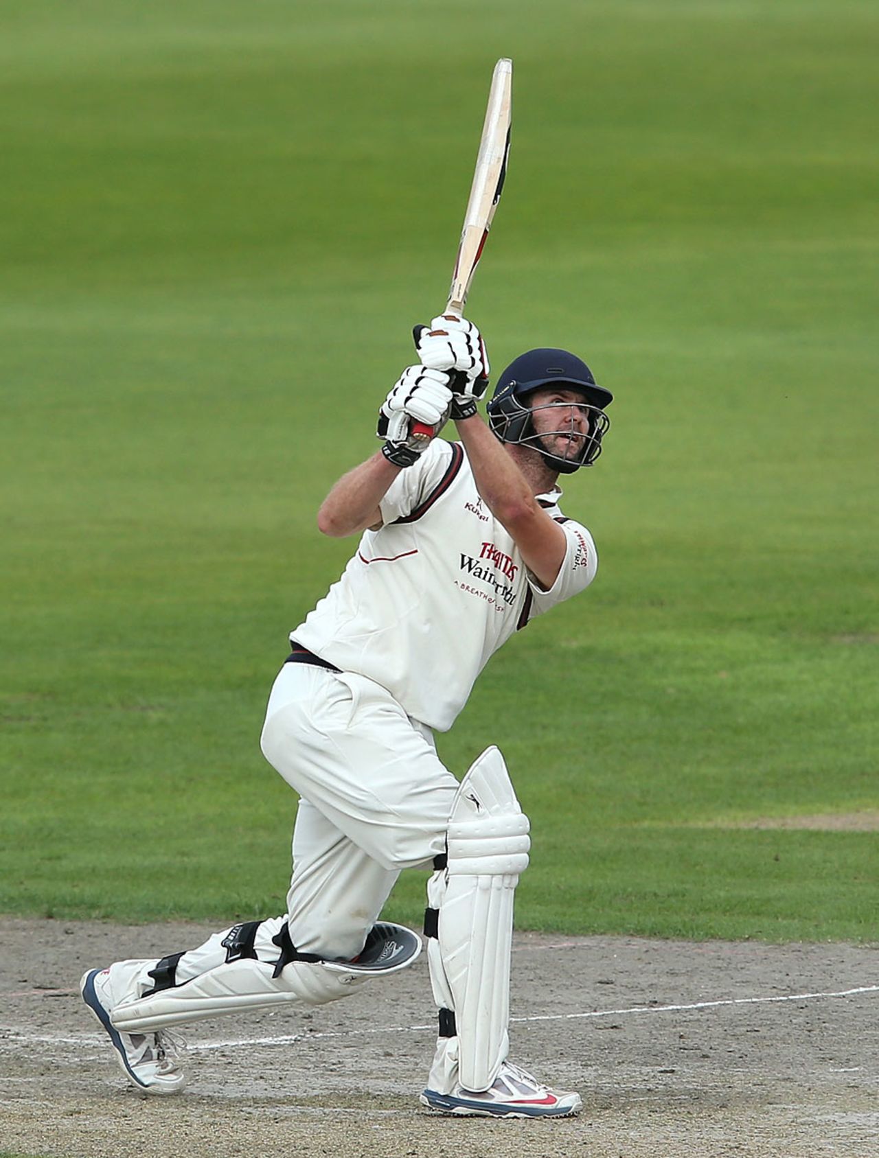 Tom Smith lofts down the ground during his 57, Lancashire v Yorkshire, County Championship, Division One, Old Trafford, August 31, 2014