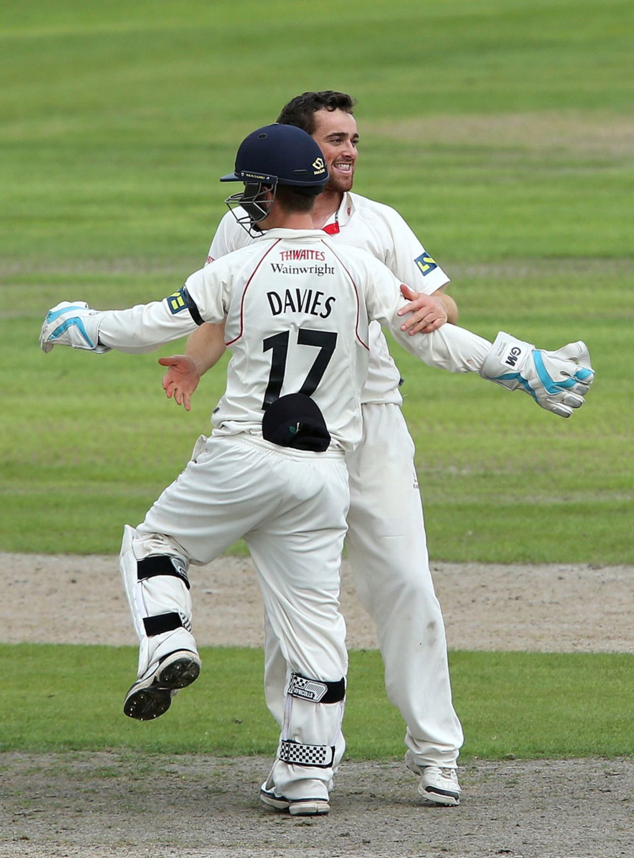 Stephen Parry celebrates a wicket with keeper Alex Davies, Lancashire v Yorkshire, County Championship, Division One, Old Trafford, September 1, 2014