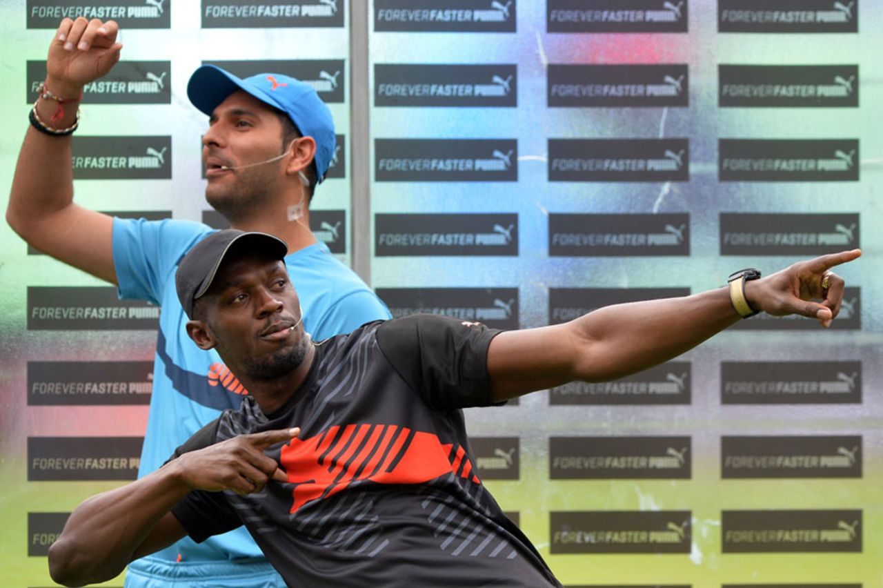 Usain Bolt provides his signature pose ahead of an exhibition match with Yuvraj Singh, Bangalore, September 2, 2014