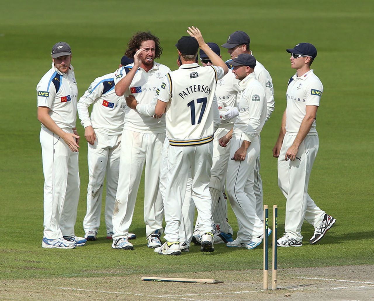 Ryan Sidebottom takes the high fives for knocking out Luis Reece's off stump, Lancashire v Yorkshire, County Championship Division One, Old Trafford, 3rd day, September 2, 2014