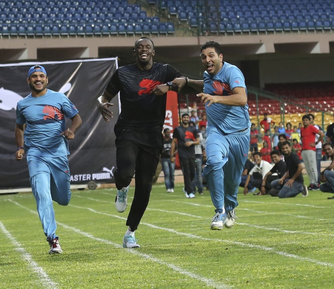 Yuvraj Singh pushes ahead of Usain Bolt in a friendly sprint, Bangalore, September 2, 2014