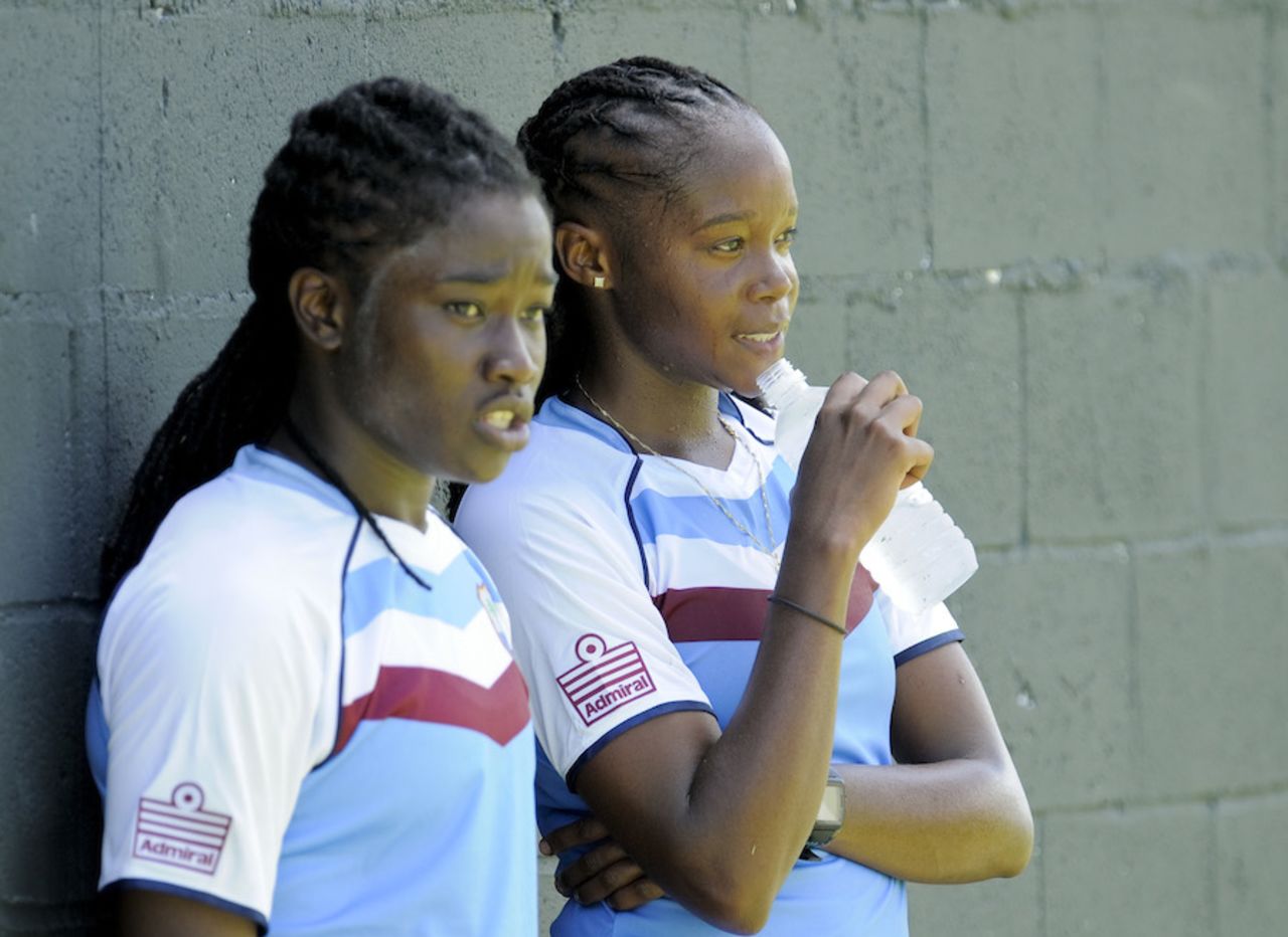 Deandra Dottin and Shaquana Quintyne take a breather during a practice session, Basseterre, September 1, 2014
