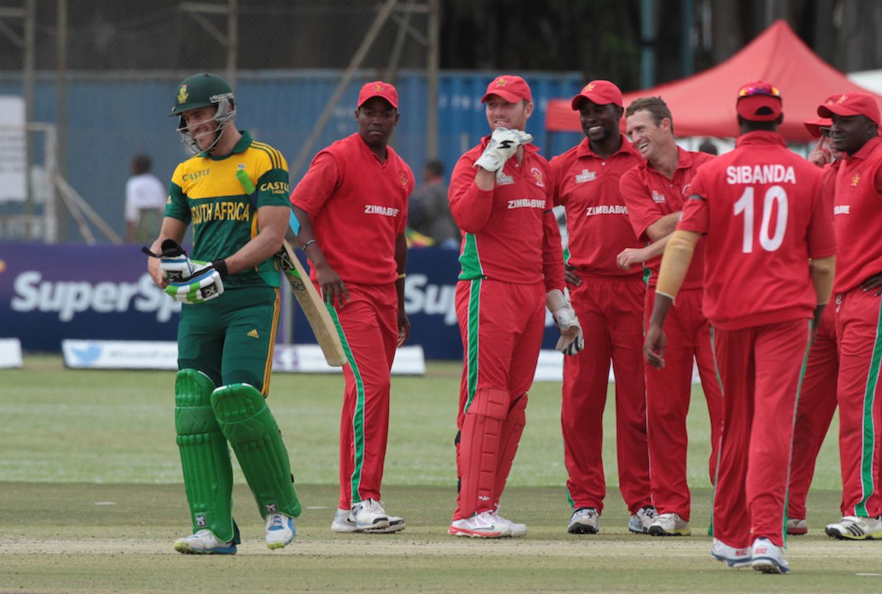 The Zimbabwe players share a light moment with Faf du Plessis , Zimbabwe v South Africa, tri-series, Harare, September 4, 2014