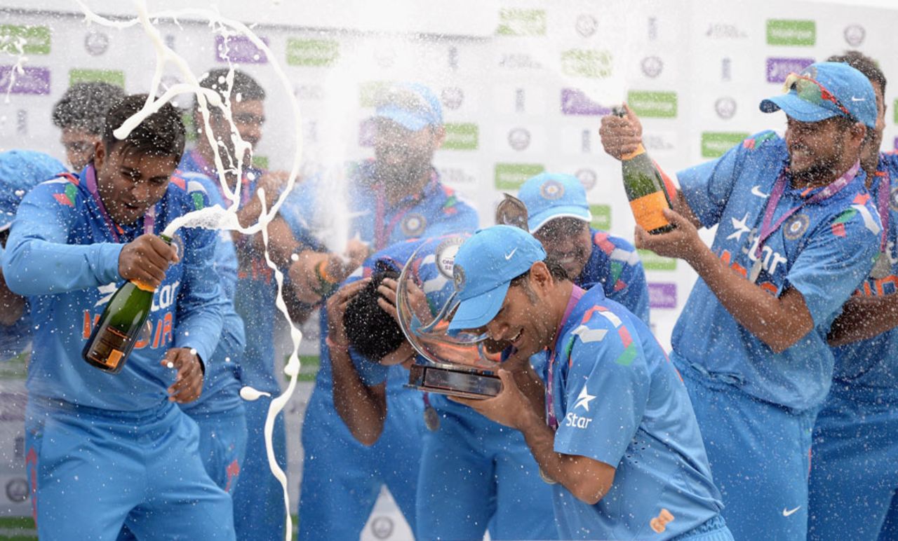 MS Dhoni uses the series trophy to shield himself from champagne corks, England v India, 5th ODI, Headingley, September 5, 2014