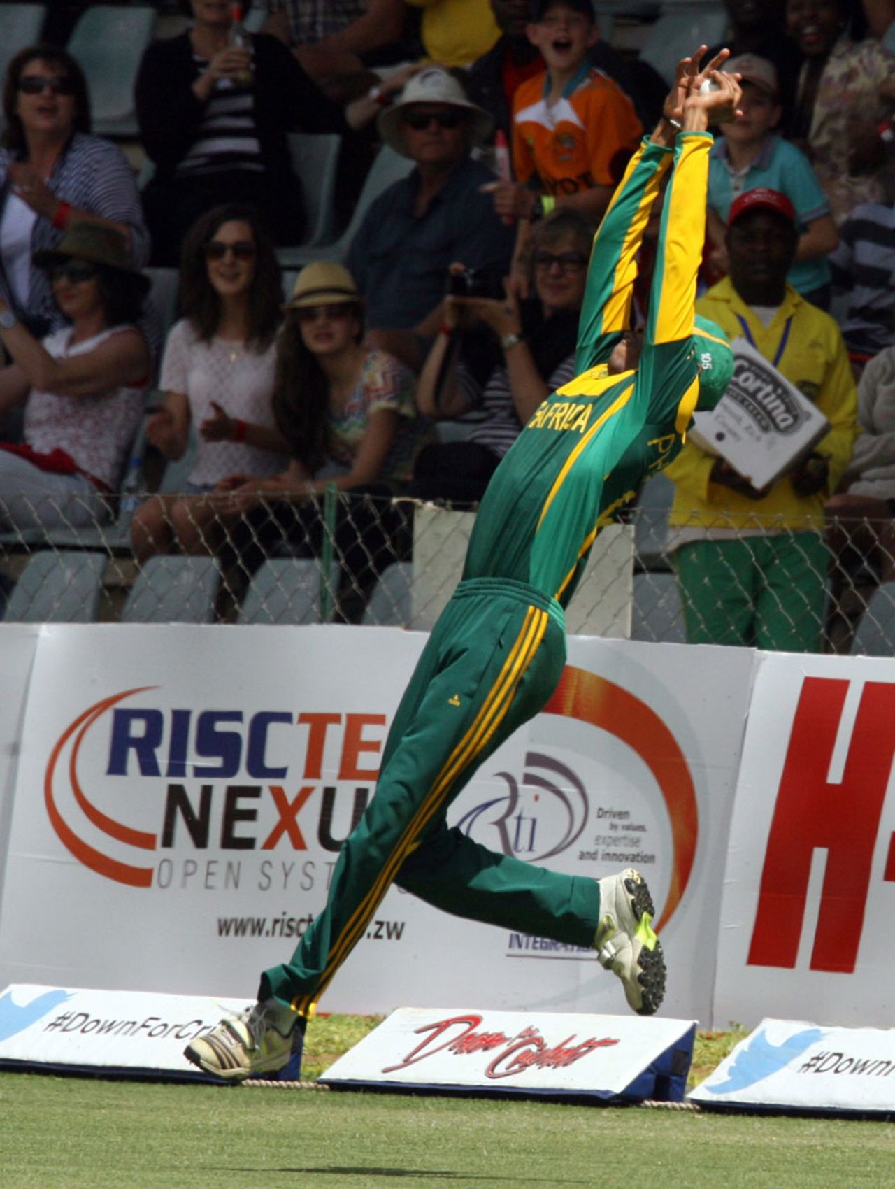 Aaron Phangiso leaps as he pulls off a catch at the boundary, Australia v South Africa, tri-series final, Harare, September 6, 2014