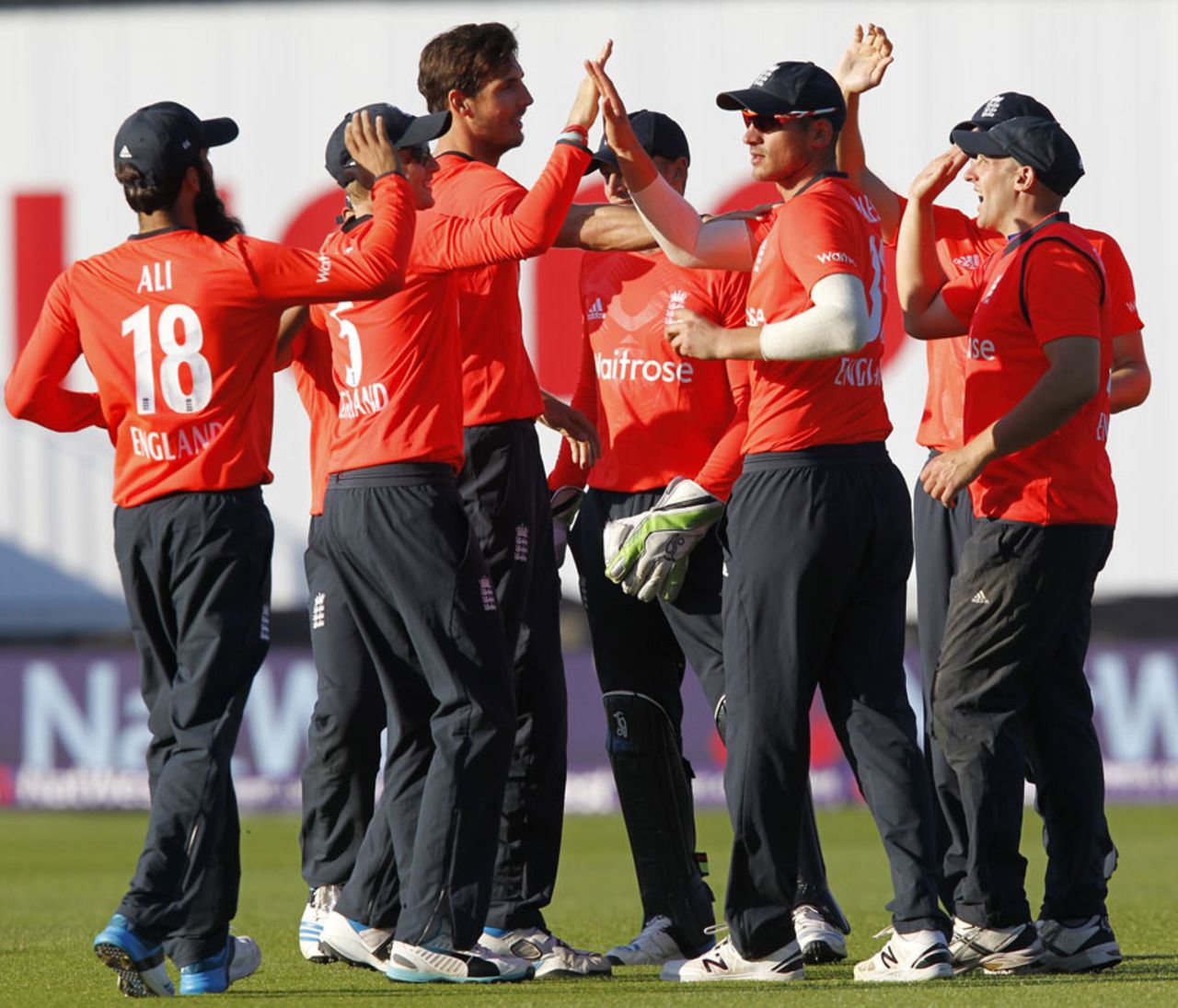 High fives all round after Steven Finn removed Virat Kohli, England v India, only T20, Edgbaston, September 7, 2014