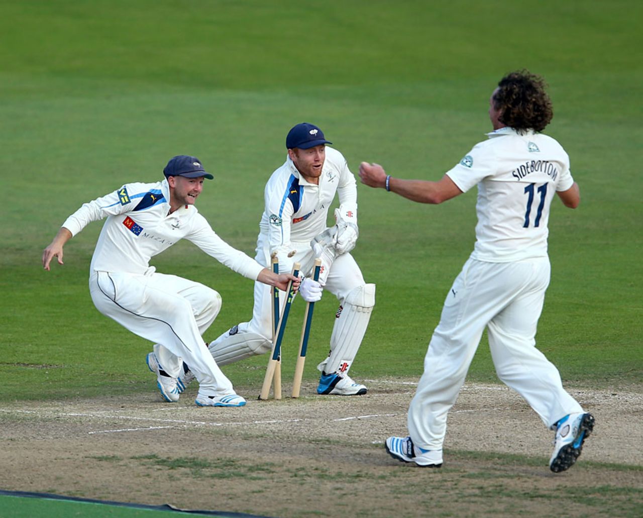 Adam Lyth and Jonny Bairstow race to grab a stump, Nottinghamshire v Yorkshire, County Championship, Division One, Trent Bridge, September 12, 2014