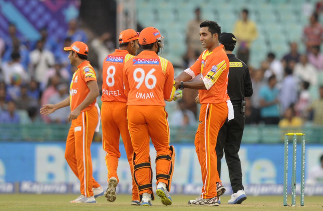 Asif Raza is congratulated after a wicket, Northern Knights v Lahore Lions, CLT20, Raipur, September 14, 2014