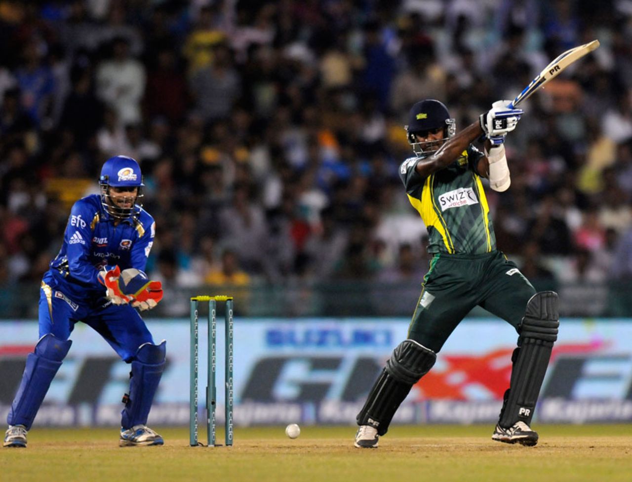 Farveez Maharoof clubs the ball during his 22-ball 41, Mumbai Indians v Southern Express, CLT20, Raipur, September 14, 2014
