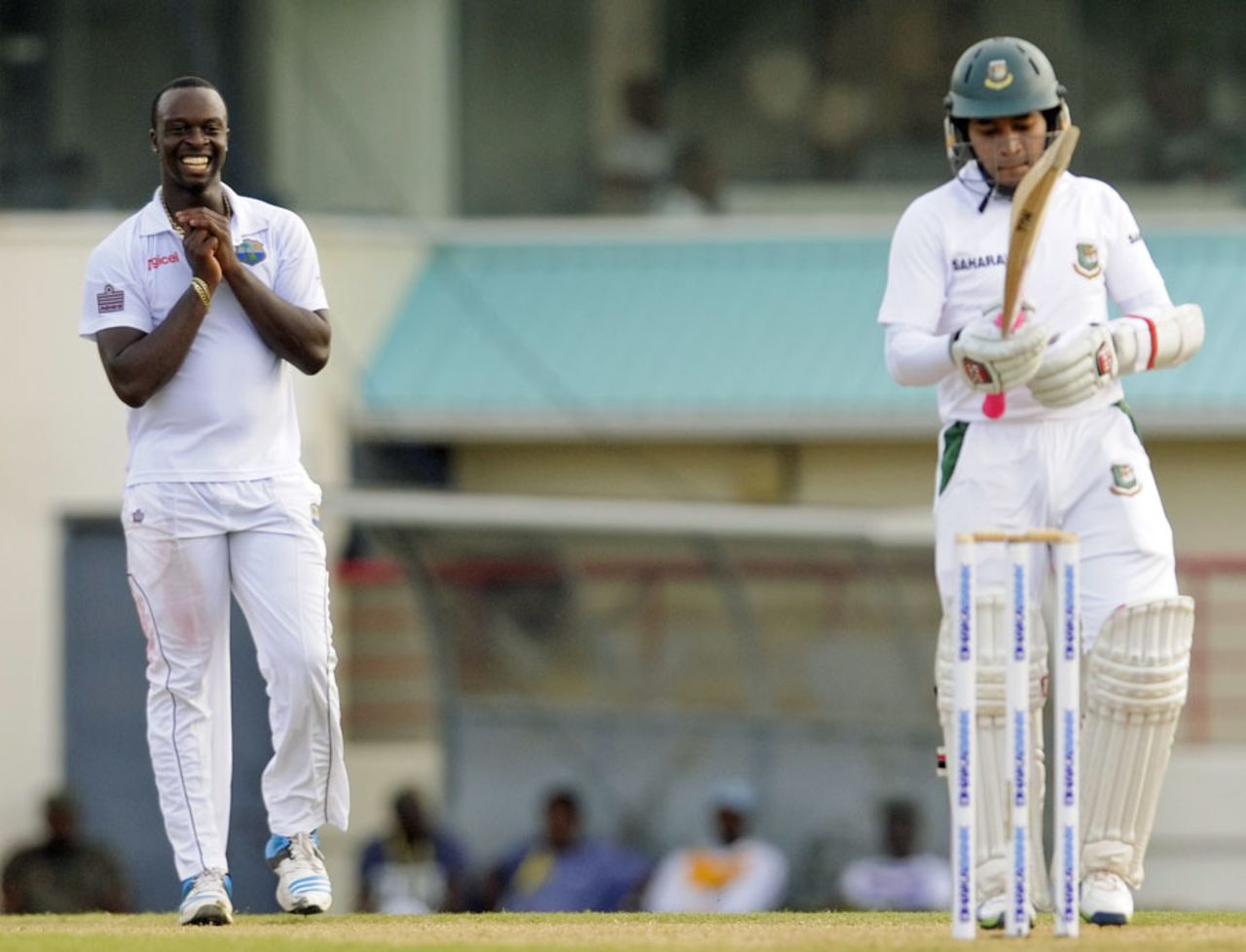 Kemar Roach smiles after bowling a delivery to Mushfiqur Rahim, West Indies v Bangladesh, 2nd Test, St. Lucia, 2nd day, September 14, 2014