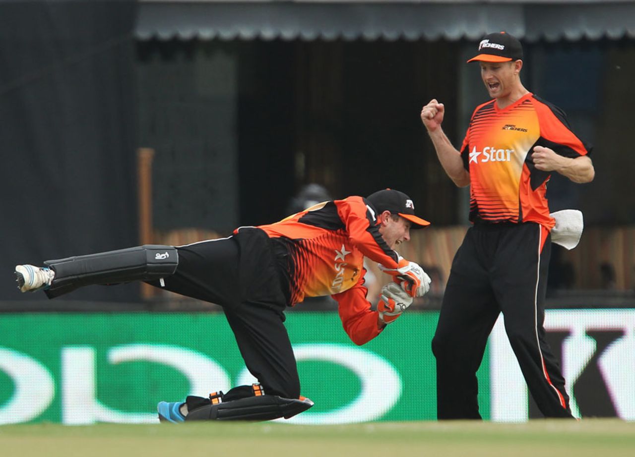 Perth Scorchers' Sam Whiteman dives as he completes a catch, Dolphins v Perth Scorchers, Champions League T20, Mohali, September 20, 2014