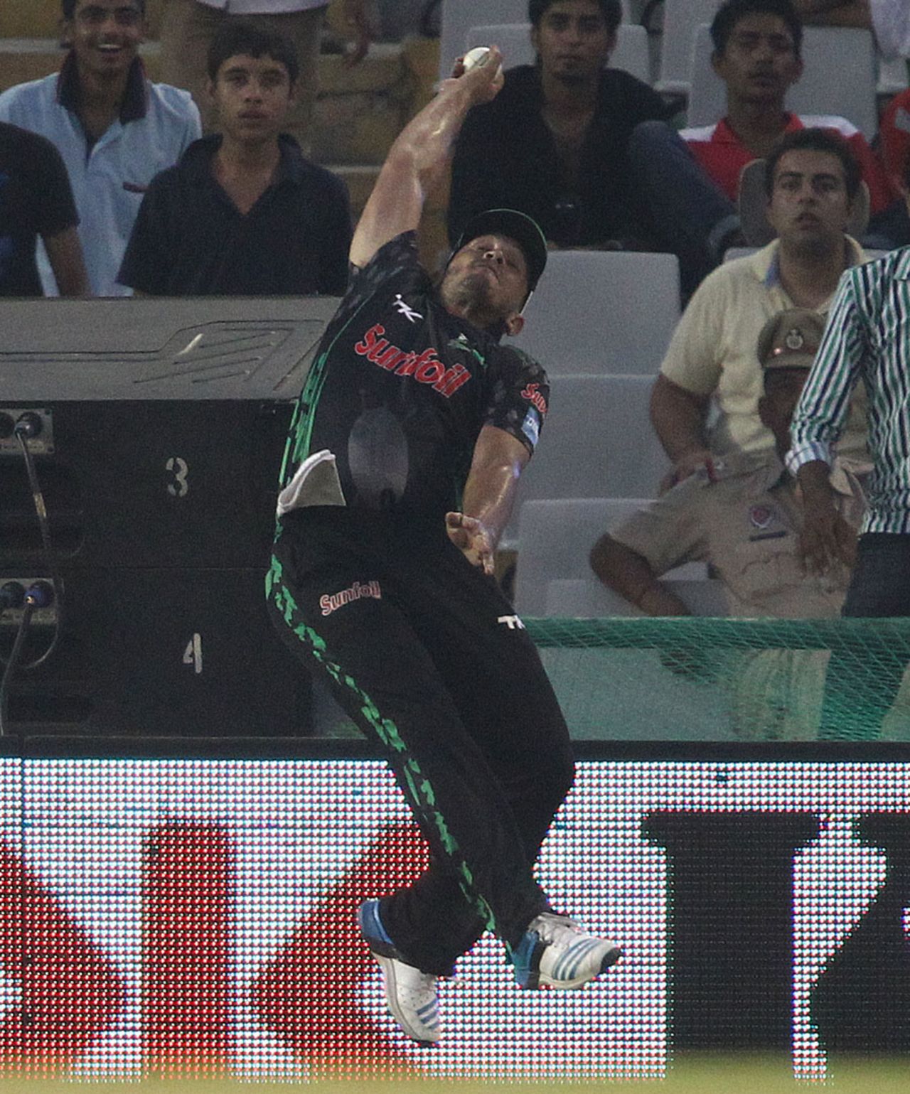 Vaughn van Jaarsveld leaps to try take a catch at the boundary, Dolphins v Perth Scorchers, Champions League T20, Mohali, September 20, 2014