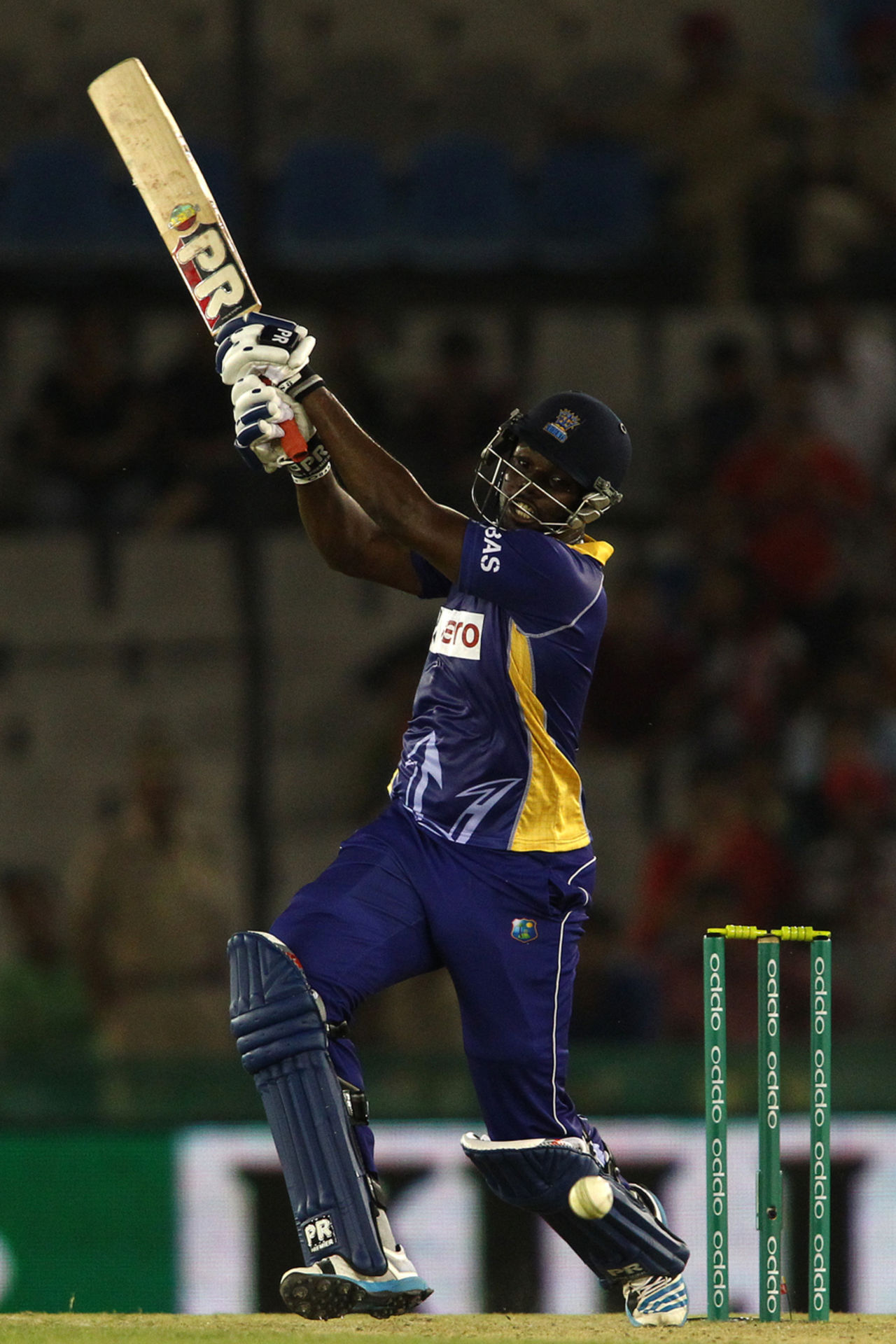 Raymon Reifer takes an almighty swing, Kings XI Punjab v Barbados Tridents, Champions League T20, Mohali, September 20, 2014