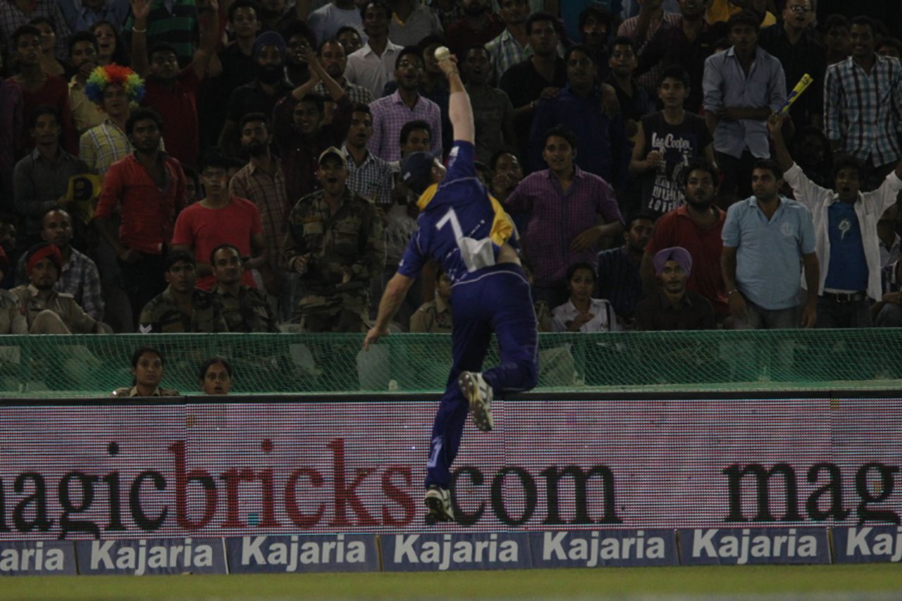 Flying Franklin: James Franklin attempts a catch on the boundary, Kings XI Punjab v Barbados Tridents, Champions League T20, Mohali, September 20, 2014