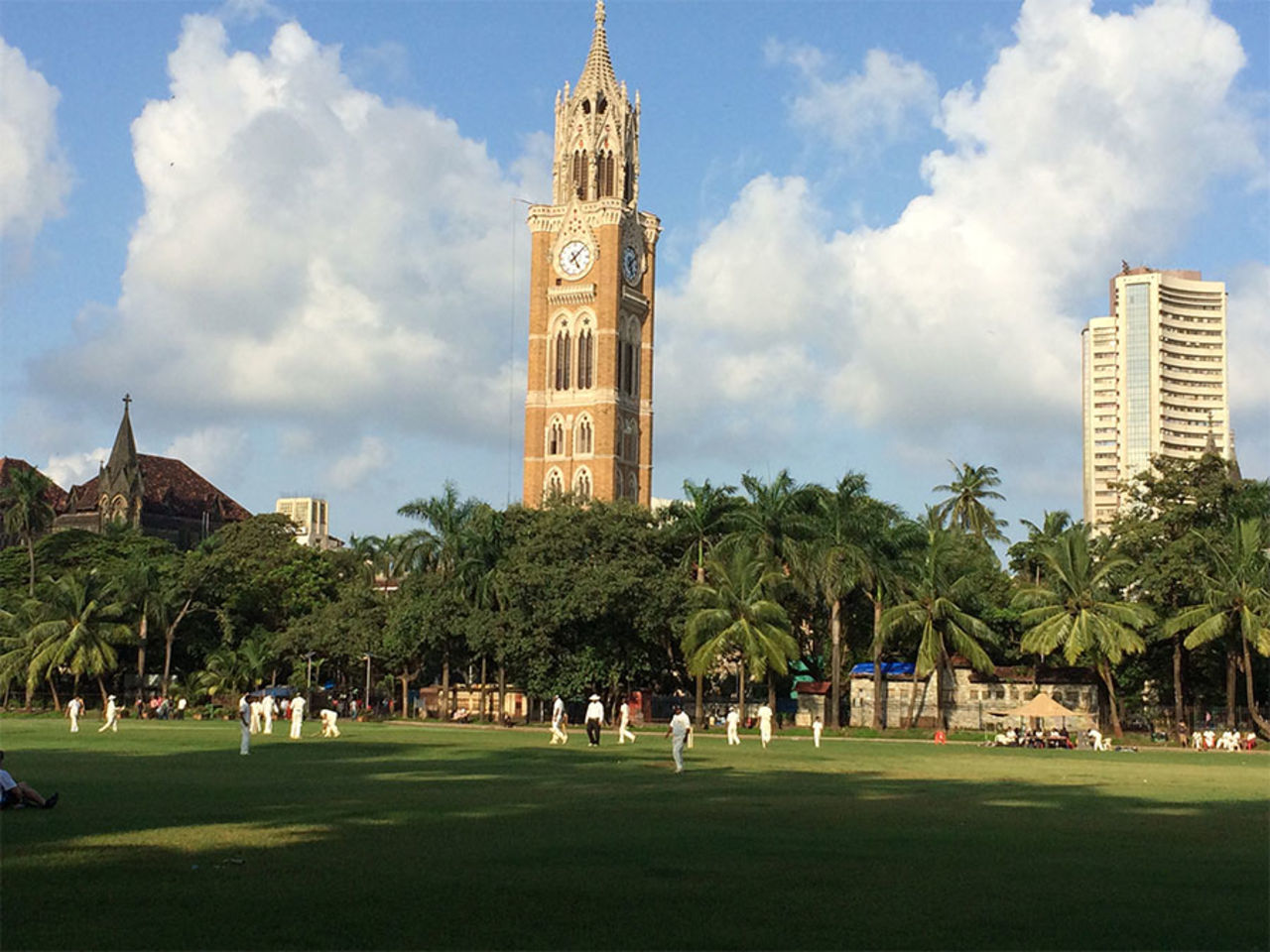 <b>Ajinkya Jain:</b> It's a beautiful monsoon evening, and Mumbaikars need no invite to play their favourite game. This picture depicts a game of club cricket being played at the historical Oval Maidan of Mumbai. The famous Rajabai Clock Tower and the Bombay Stock Exchange can be seen in the background.