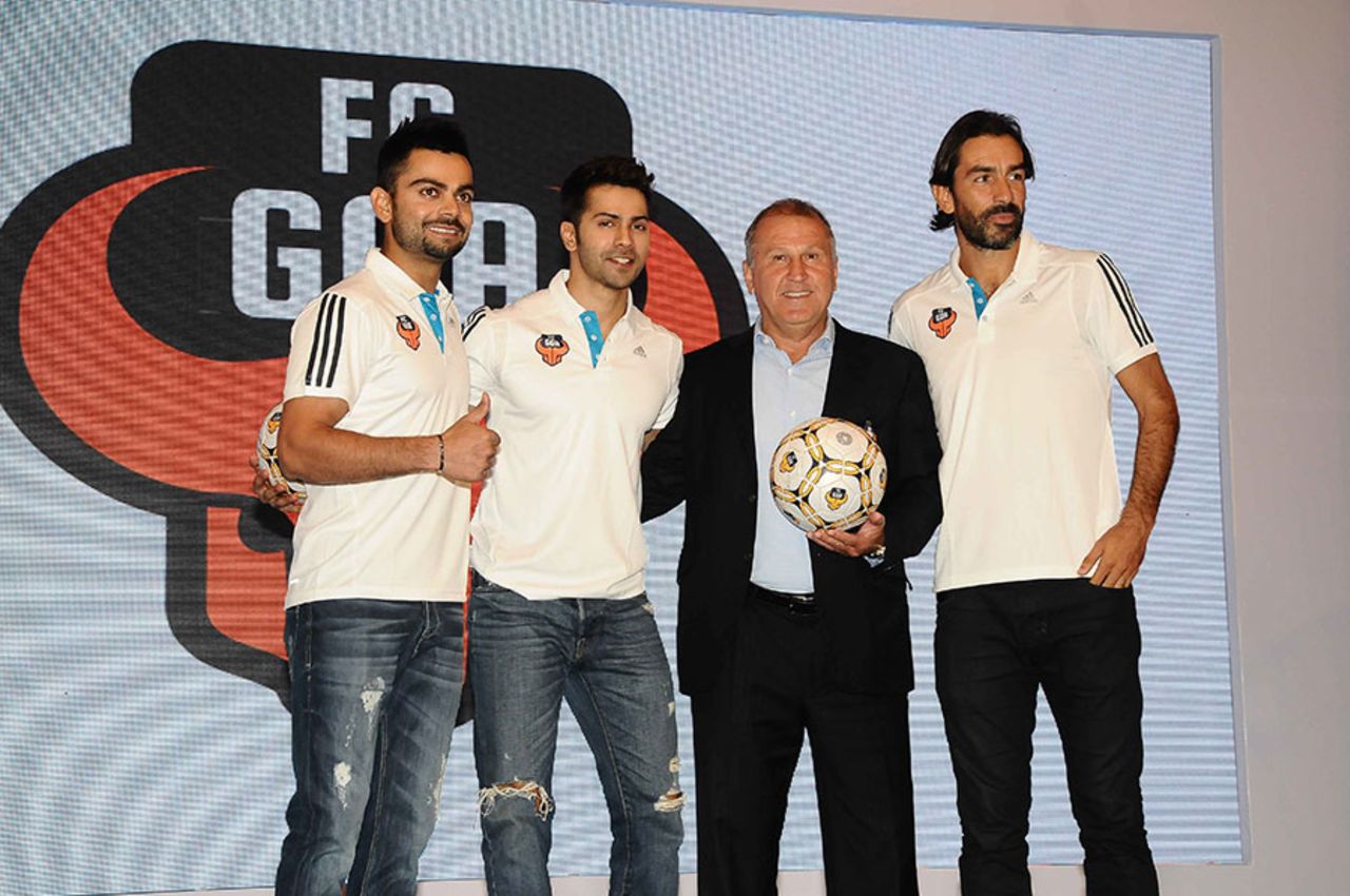 Virat Kohli, the co-owner of FC Goa, alongside coach Zico and marquee player Robert Pires, New Delhi, September 24, 2014