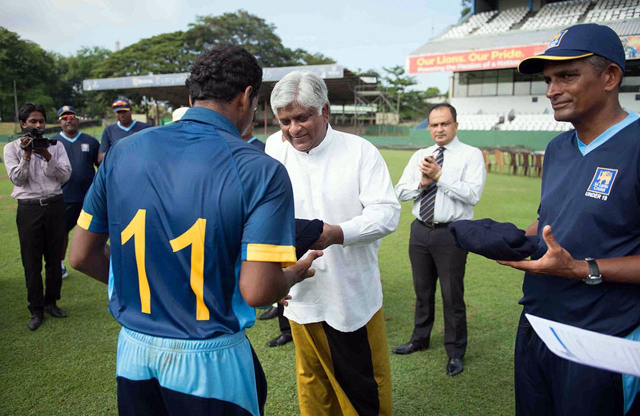 Chamika Karunaratne, the Sri Lanka U-19 captain, receives his cap from Arjuna Ranatunga, Sri Lanka U-19 v Australia U-19, 1st Youth ODI, Colombo, September 25, 2014