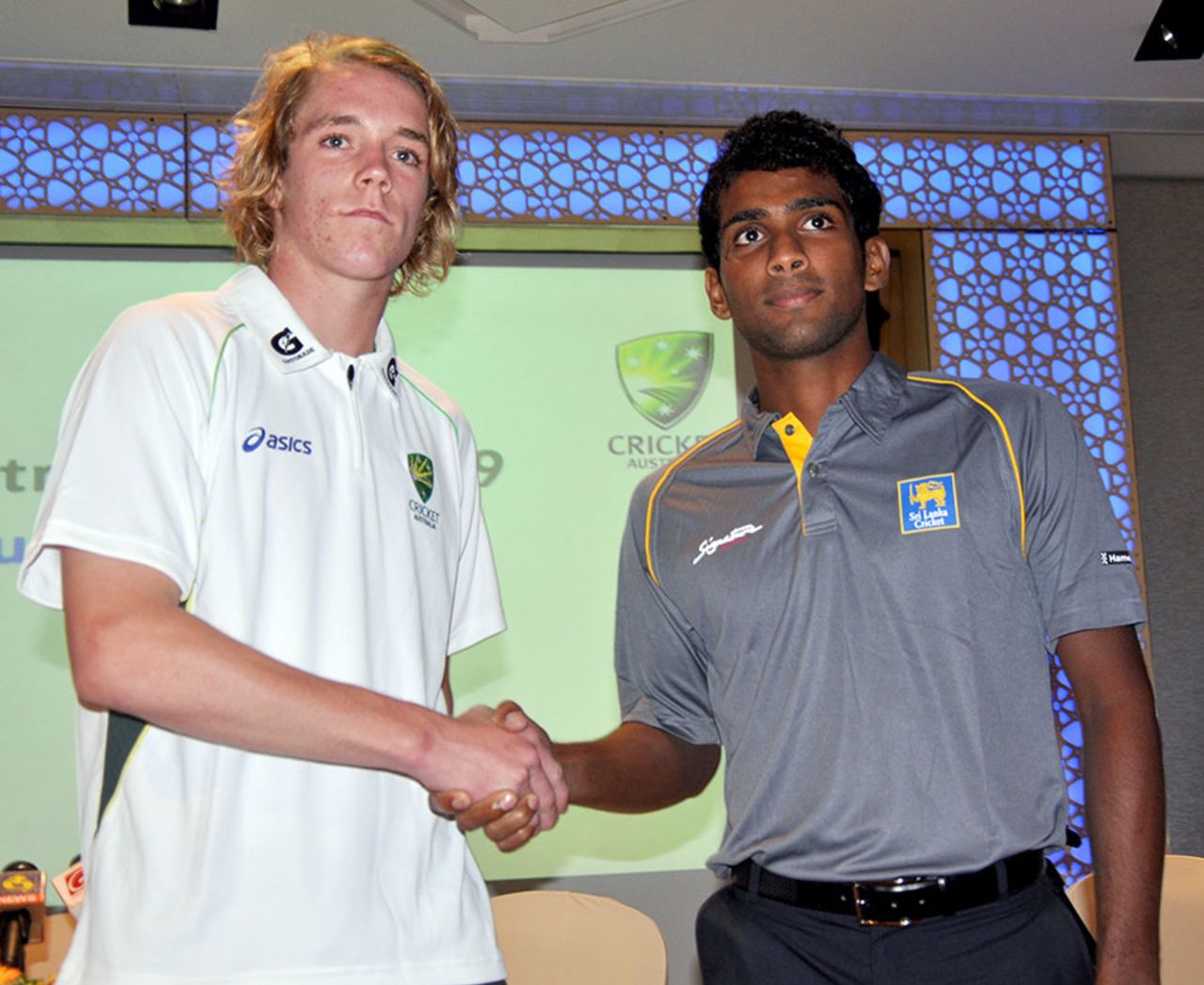 Patrick McKenna and Chamika Karunaratne, the captains of the Australia and Sri Lanka U-19 teams, shake hands, Colombo, September 24, 2014